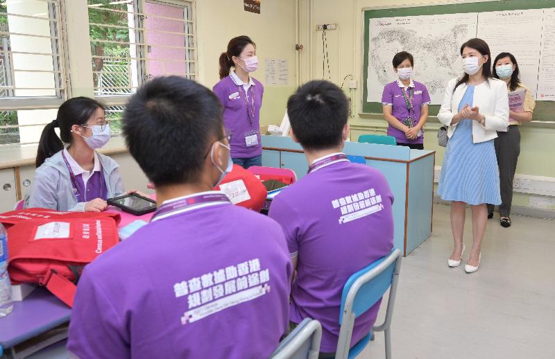 The Commissioner for Census and Statistics, Ms Marion Chan (right), visits the 2021 Population Census field centre in Wan Chai today (July 17) to learn more about the work of the census officers and give them encouragement.
