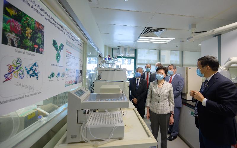 The Chief Executive, Mrs Carrie Lam, today (July 19) visited Hong Kong Baptist University (HKBU). Photo shows Mrs Lam (third right), accompanied by the Chairman of the Council and the Court of HKBU, Dr Clement Chen (second right), and the President and Vice-Chancellor of HKBU, Professor Alexander Wai (second left), touring the Chinese Medicine Pharmaceutics Laboratory of the School of Chinese Medicine.