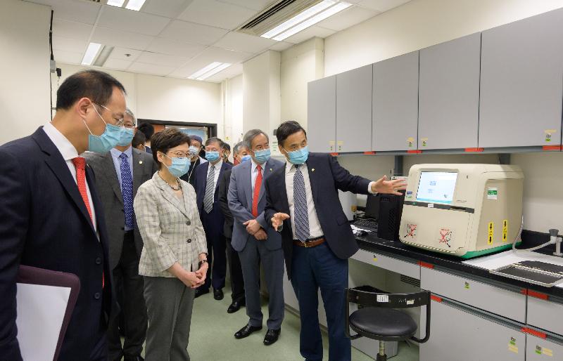 The Chief Executive, Mrs Carrie Lam, today (July 19) visited Hong Kong Baptist University (HKBU). Photo shows Mrs Lam (second left), accompanied by the Chairman of the Council and the Court of HKBU, Dr Clement Chen (second right), and the President and Vice-Chancellor of HKBU, Professor Alexander Wai (first left), touring the centre for cancer and inflammation research of the School of Chinese Medicine.