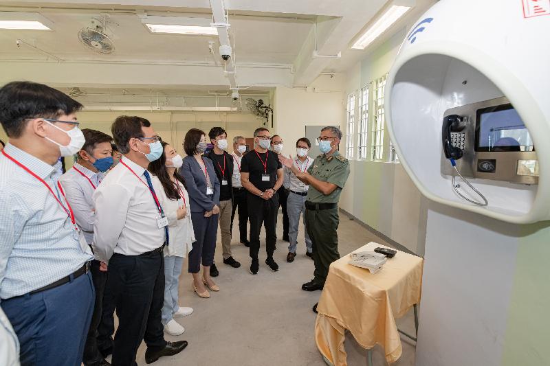 The Legislative Council Panel on Security visits the Tai Tam Gap Correctional Institution to better understand the operation and future development of "Smart Prison". Photo shows Members of the Legislative Council being briefed by the Commissioner of Correctional Services, Mr Woo Ying-ming (first right), on the Integrated Intelligent Communication System, which allows persons in custody to make phone calls to designated persons by themselves.