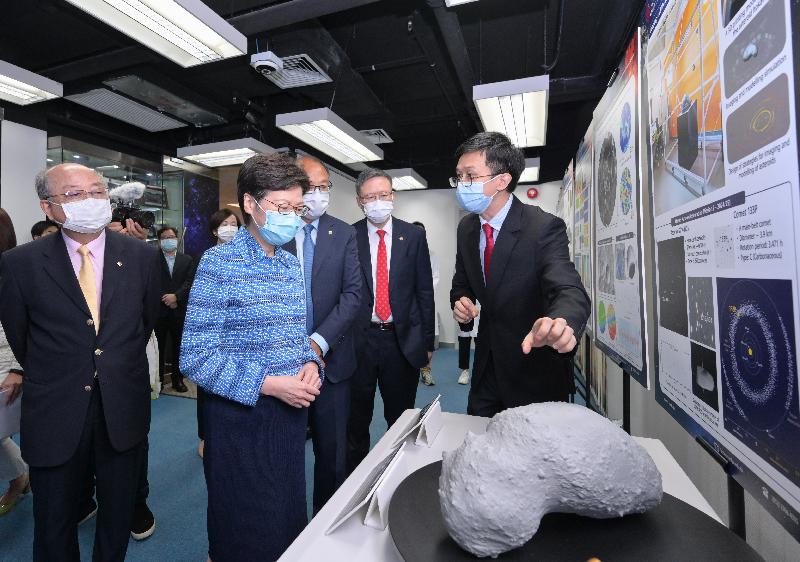The Chief Executive, Mrs Carrie Lam, today (July 23) visited the Hong Kong Polytechnic University (PolyU). Photo shows Mrs Lam (second left), accompanied by the Chairman of the Council of PolyU, Dr Lam Tai-fai (third left), and the President of PolyU, Professor Teng Jin-guang (second right), touring the Research Centre for Deep Space Explorations.
