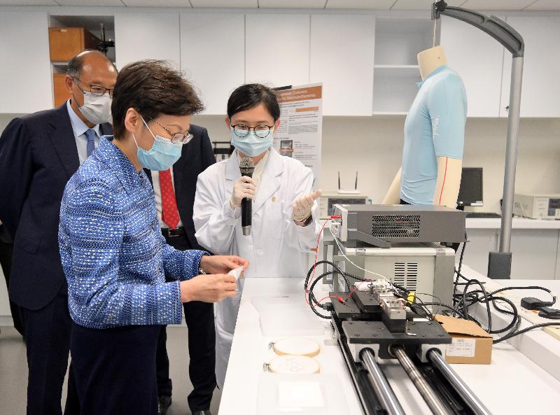 The Chief Executive, Mrs Carrie Lam, today (July 23) visited the Hong Kong Polytechnic University (PolyU). Photo shows Mrs Lam (second left), accompanied by the Chairman of the Council of PolyU, Dr Lam Tai-fai (first left), touring the Materials Science Laboratory.