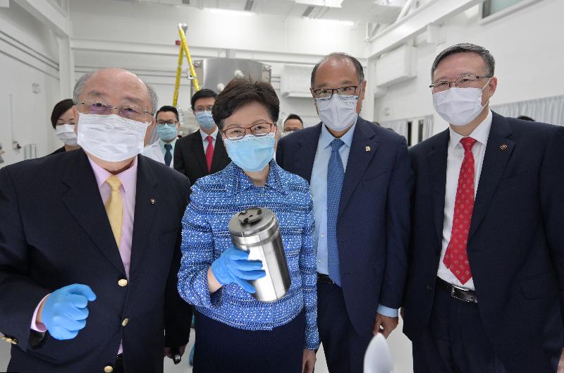 The Chief Executive, Mrs Carrie Lam, today (July 23) visited the Hong Kong Polytechnic University (PolyU). Photo shows Mrs Lam (second left), accompanied by the Chairman of the Council of PolyU, Dr Lam Tai-fai (second right); the President of PolyU, Professor Teng Jin-guang (first right); and the Director of Research Centre for Deep Space Explorations, Professor Yung Kai-leung (first left), viewing at the Centre the container developed by PolyU that sealed and stored the lunar samples on their way back to Earth from the moon in the nation's lunar exploration mission.