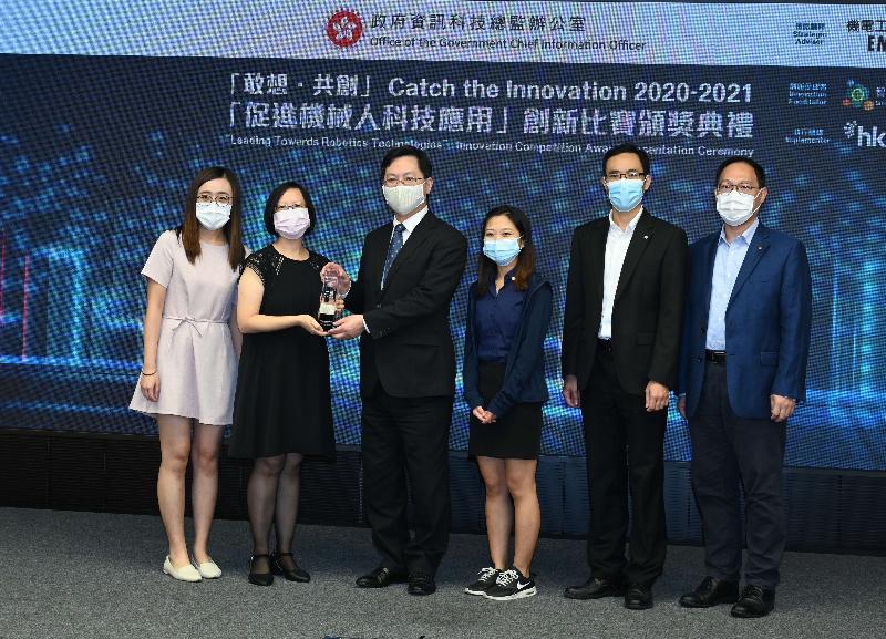 The Secretary for Innovation and Technology, Mr Alfred Sit (third left), presents an award to the first runner-up, representatives from the Electrical and Mechanical Services Department, at the Leading Towards Robotics Technologies Innovation Competition Award Presentation Ceremony today (July 28). Their winning project is "Application of Artificial Intelligence and Robotics Technologies for Smart Warehouse".