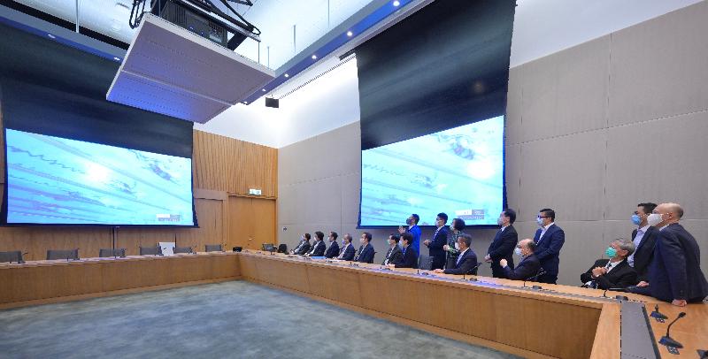 The Chief Executive, Mrs Carrie Lam (front row, seventh left), today (July 28) watches the Women's 200m Freestyle competition of the Tokyo 2020 Olympic Games through live TV broadcast with officials including Secretaries of Department and Directors of Bureau to cheer for Hong Kong swimmer Siobhan Bernadette Haughey.