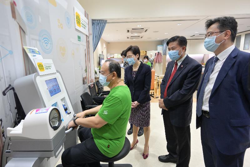 The Chief Executive, Mrs Carrie Lam, today (July 30) visited Lingnan University (LU). Photo shows Mrs Lam (second left), accompanied by the LU President, Professor Leonard Cheng (second right), touring the LU Jockey Club Gerontech-X Lab.