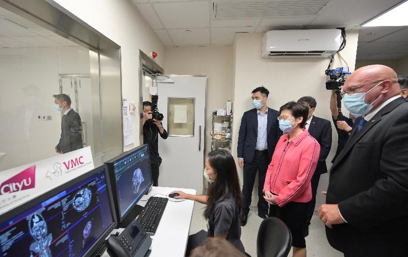The Chief Executive, Mrs Carrie Lam, today (August 3) visited the City University of Hong Kong (CityU) Veterinary Medical Centre (VMC) in Sham Shui Po. Photo shows Mrs Lam (second left) receiving a briefing from the Executive Director of the CityU VMC, Dr Duncan Hockley (first right), on the diagnostic facilities. 
