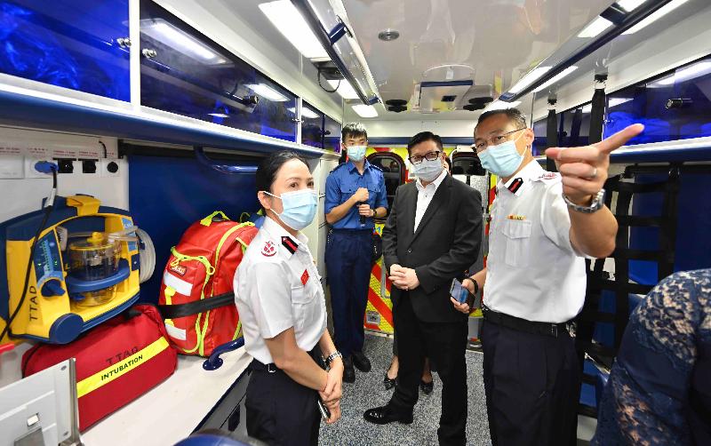 The Secretary for Security, Mr Tang Ping-keung (second right), visited the Tsim Tung Fire Station today (August 9) to inspect its equipment for fire and ambulance services and learned how the Fire Services Department utilises technology to enhance emergency services. Photo shows Mr Tang, accompanied by the Director of Fire Services, Mr Joseph Leung (first right), inspecting the equipment on an ambulance.