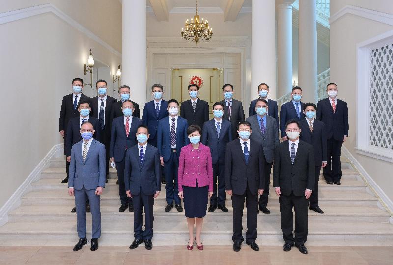 The Chief Executive, Mrs Carrie Lam (first row, centre), hosted a luncheon for a delegation led by Deputy Director of the Hong Kong and Macao Affairs Office of the State Council Mr Huang Liuquan (first row, second left), at Government House after attending a talk on the National 14th Five-Year Plan this morning (August 23). Mrs Lam; Mr Huang; Deputy Director of the Liaison Office of the Central People's Government in the Hong Kong Special Administrative Region Mr Yin Zonghua (first row, second right); the Secretary for Innovation and Technology, Mr Alfred Sit (first row, first right); the Secretary for Constitutional and Mainland Affairs, Mr Erick Tsang Kwok-wai (first row, first left); the Secretary for Financial Services and the Treasury, Mr Christopher Hui (second row, second left); the Director of the Chief Executive's Office, Mr Chan Kwok-ki (second row, second right); and other guests are pictured at Government House.