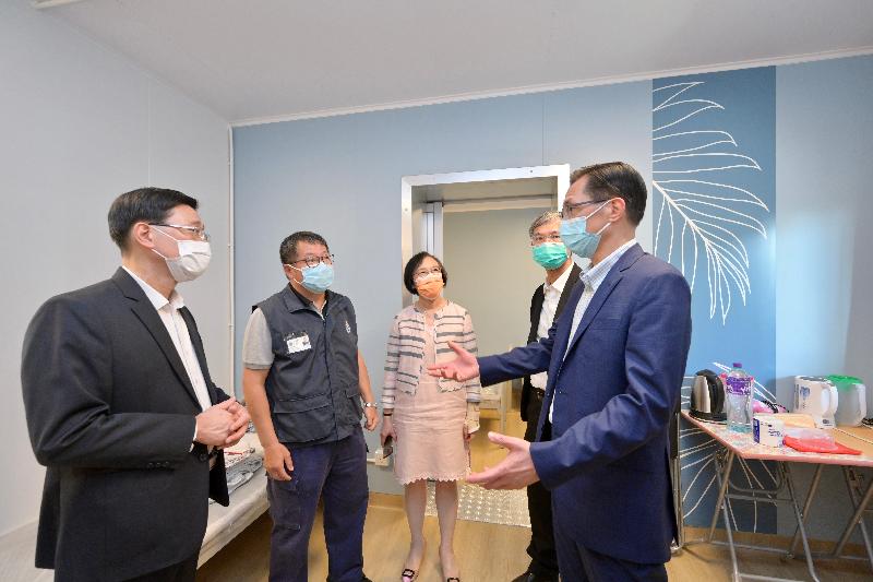 The Chief Secretary for Administration, Mr John Lee, visited Penny's Bay Quarantine Centre on Lantau Island this afternoon (September 7) to view the preparatory work for opening some of the quarantine units at the centre for foreign domestic helpers arriving in Hong Kong. Photo shows Mr Lee (first left), accompanied by the Secretary for Labour and Welfare, Dr Law Chi-kwong (second right), and the Secretary for Food and Health, Professor Sophia Chan (centre), touring a quarantine unit and being briefed by the Commissioner of the Civil Aid Service, Mr Lo Yan-lai (first right), on its facilities.