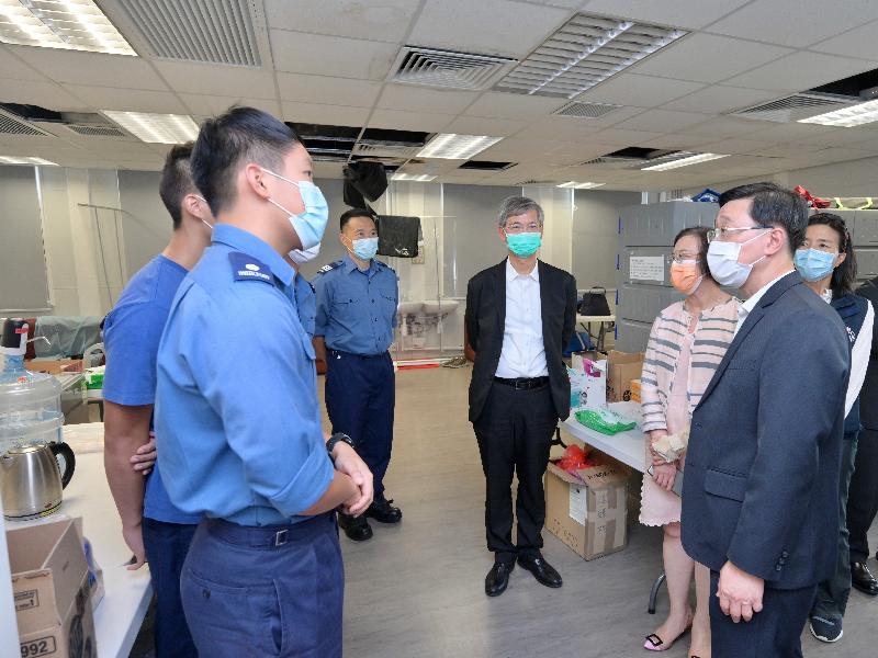 The Chief Secretary for Administration, Mr John Lee, visited Penny's Bay Quarantine Centre on Lantau Island this afternoon (September 7) to view the preparatory work for opening some of the quarantine units at the centre for foreign domestic helpers arriving in Hong Kong. Photo shows Mr Lee (second right) chatting with colleagues from the Fire Services Department to learn about their work in operating the quarantine centre. Looking on are the Secretary for Labour and Welfare, Dr Law Chi-kwong (fourth right), and the Secretary for Food and Health, Professor Sophia Chan (third right).