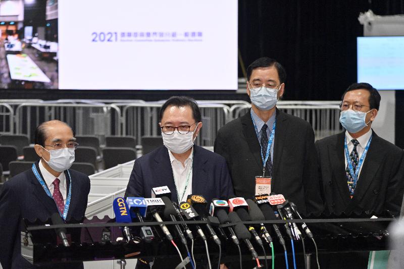 The Chairman of the Electoral Affairs Commission (EAC), Mr Justice Barnabas Fung Wah (second left); EAC members Mr Arthur Luk, SC (first left) and Professor Daniel Shek (second right); and the Chief Electoral Officer, Mr Alan Yung (first right), meet the media to conclude the count this morning (September 20) at the media centre of the 2021 Election Committee Subsector Ordinary Elections in the Hong Kong Convention and Exhibition Centre.