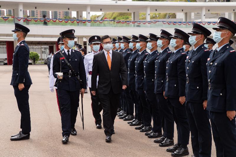The Secretary for Security, Mr Tang Ping-keung, reviews the 190th Fire Services passing-out parade at the Fire and Ambulance Services Academy today (September 23).
