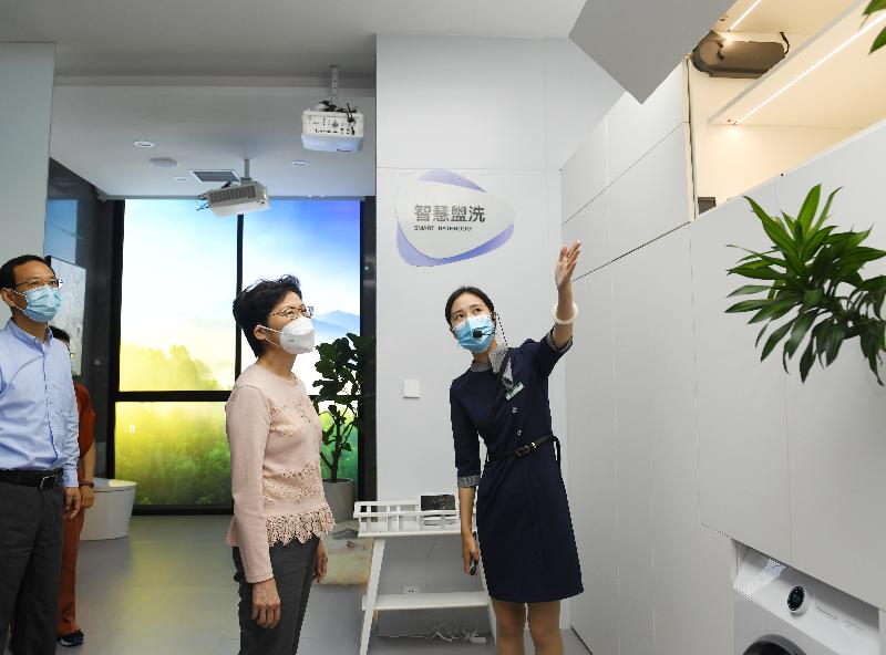 The Chief Executive, Mrs Carrie Lam, visited the Lijia Smart Park in the Liangjiang New Area of Chongqing today (September 25). Photo shows Mrs Lam (centre), accompanied by the Executive Vice Mayor of Chongqing, Mr Wang Fu (left), touring an exhibition gallery.