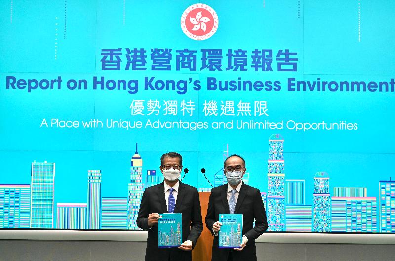The Financial Secretary, Mr Paul Chan (left), accompanied by the Deputy Government Economist, Mr Adolph Leung (right), meets the media at the Central Government Offices, Tamar, today (September 27) on the release of "Report on Hong Kong's Business Environment: A Place with Unique Advantages and Unlimited Opportunities".
