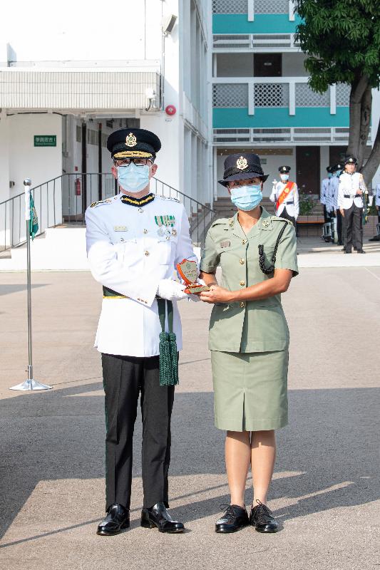 Hong Kong Customs held a passing-out parade, including a Chinese-style flag-raising ceremony and foot drill performance, for the 129th-132nd Customs Inspector Induction Courses and the 475th-478th Customs Officer Induction Courses at the Hong Kong Customs College today (October 19). Photo shows the Commissioner of Customs and Excise, Mr Hermes Tang (left), presenting a Whistle of Honour to Ms Chong Hiu-kam, the best recruit of the Customs Officer Induction Courses.
