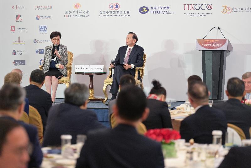The Chief Executive, Mrs Carrie Lam, attended the Joint Business Community Luncheon today (November 2). Photo shows Mrs Lam (left) fielding questions from the floor during the question-and-answer session.