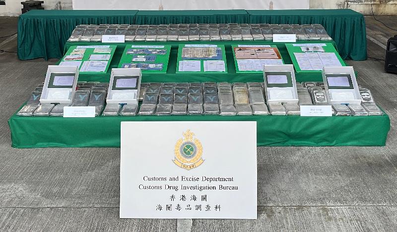 Hong Kong Customs on October 19 seized about 260 kilograms of suspected cocaine with an estimated market value of about $300 million at the Tsing Yi Customs Cargo Examination Compound. Customs officers found that the case also involved money laundering activities, in which about $130 million of suspected crime proceeds had been laundered. Photo shows the suspected cocaine seized and the items suspected to be connected to money laundering activities, including shipping documents, bank statements, banking security authentication tokens, signed cheques and cash.