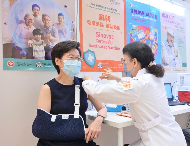 The Chief Executive, Mrs Carrie Lam (left), today (November 11) receives her third dose of the Sinovac vaccine at the Community Vaccination Centre at Java Road Sports Centre.