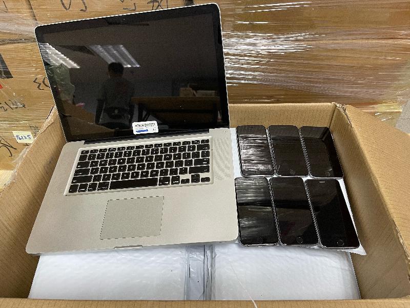 Hong Kong Customs and the Marine Police mounted a joint anti-smuggling operation on November 13 and detected a suspected speedboat-related smuggling case in Tung Chung. A batch of suspected smuggled goods, including high-value food, electronic products and veterinary products, with an estimated value of about $21 million was seized. Photo shows some of the suspected smuggled smartphones and tablet computers seized.