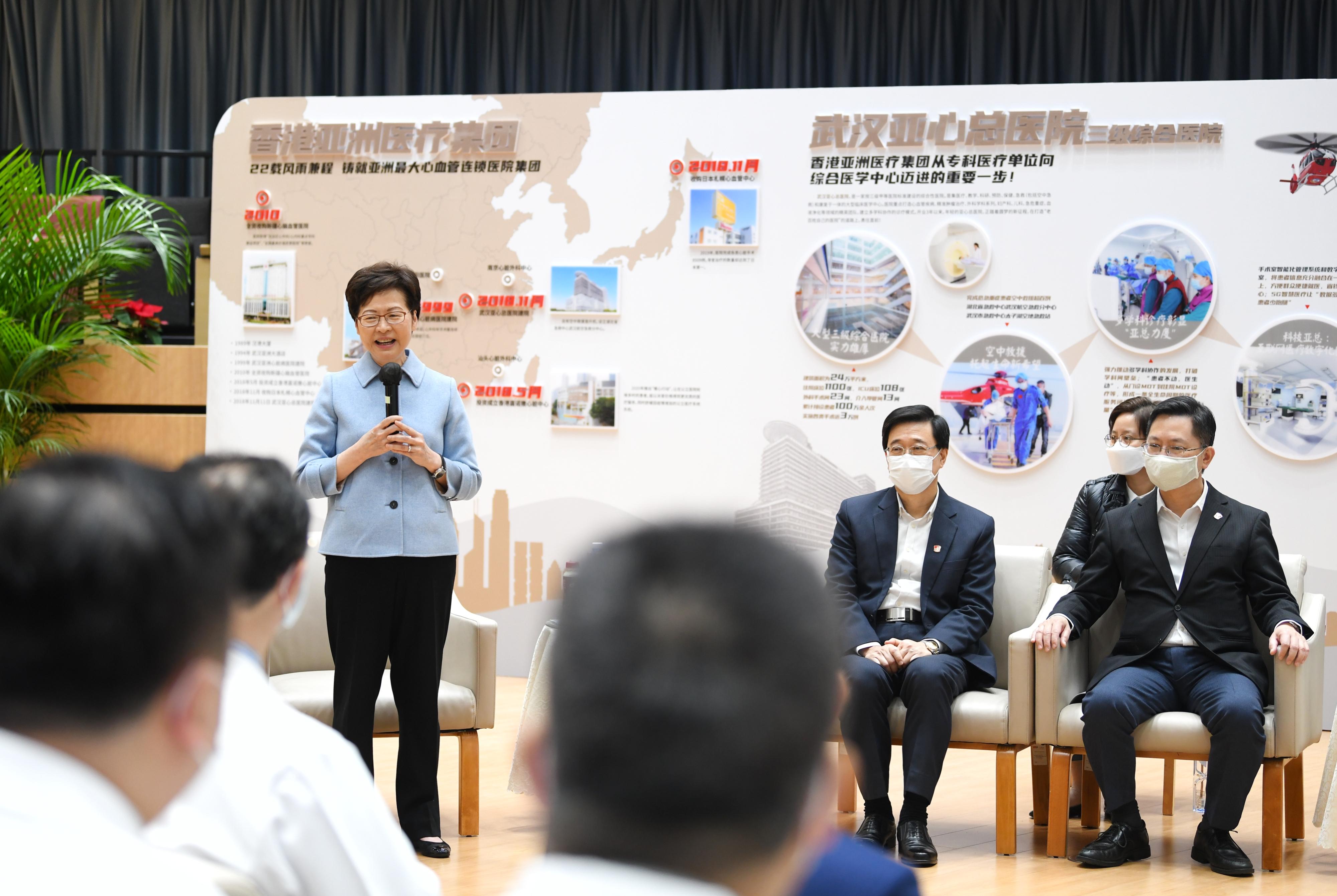 The Chief Executive, Mrs Carrie Lam, visited Wuhan Asia General Hospital, a Hong Kong enterprise, in Wuhan today (November 29). Photo shows Mrs Lam (first left) in an exchange session with medical staff. Looking on are the Chief Secretary for Administration, Mr John Lee (third right), and the Secretary for Innovation and Technology, Mr Alfred Sit (first right).