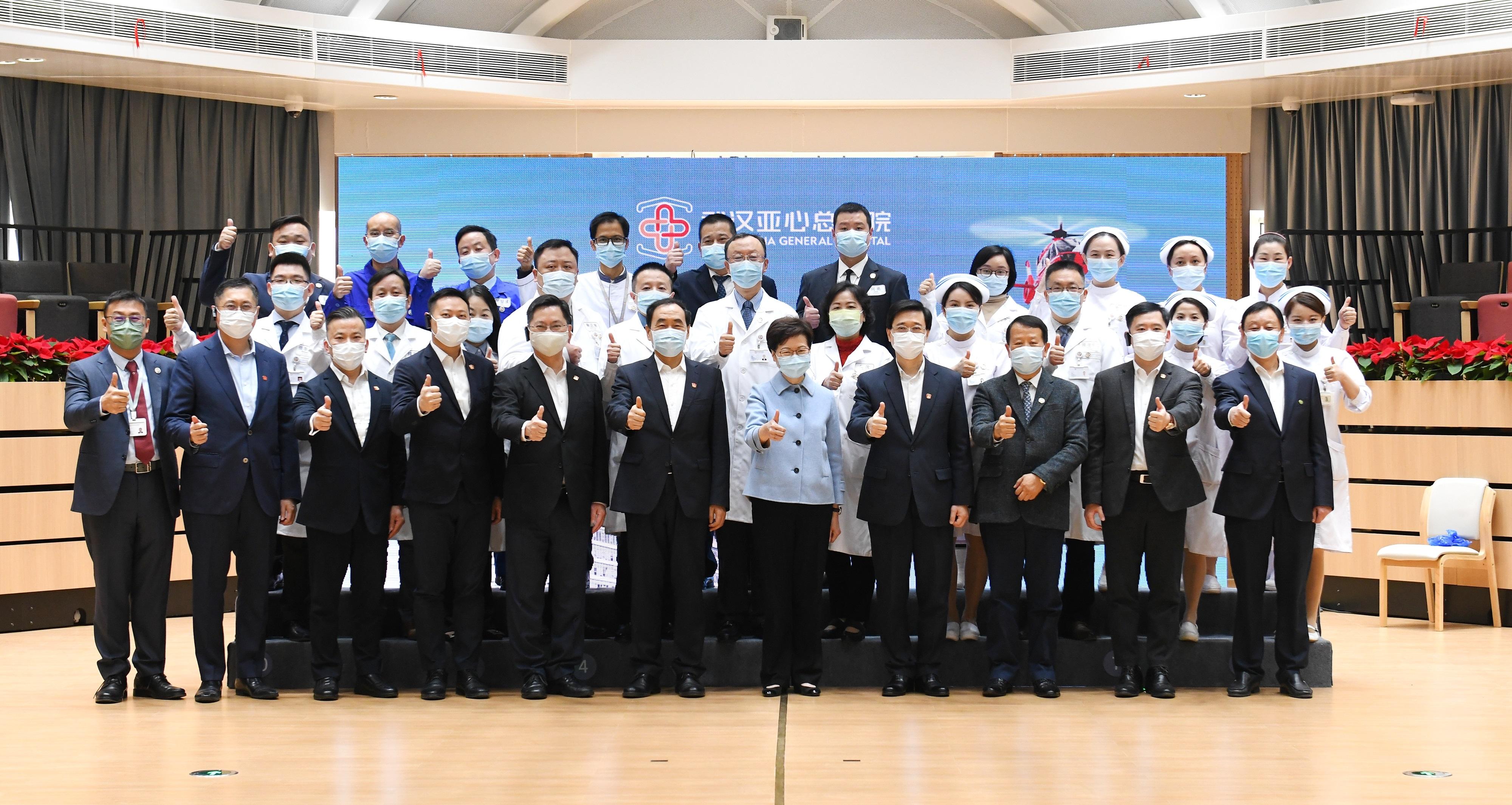 The Chief Executive, Mrs Carrie Lam, visited Wuhan Asia General Hospital, a Hong Kong enterprise, in Wuhan today (November 29). Mrs Lam (front row, fifth right) is pictured with Vice Governor of Hubei Province Mr Zhao Haishan (front row, sixth left); the Chief Secretary for Administration, Mr John Lee (front row, fourth right); the Secretary for Innovation and Technology, Mr Alfred Sit (front row, fifth left); the Secretary for Home Affairs, Mr Caspar Tsui (front row, fourth left); the Under Secretary for Constitutional and Mainland Affairs, Mr Clement Woo (front row, second right); the Chairman of Hong Kong Asia Medical Group, Mr Tse Chun-ming (front row, third right); the general manager of Wuhan Asia General Hospital, Mr Steven Tse  (front row, first left); the director of Wuhan Asia General Hospital, Professor Su Xi (second row, sixth right); and medical staff and other guests.