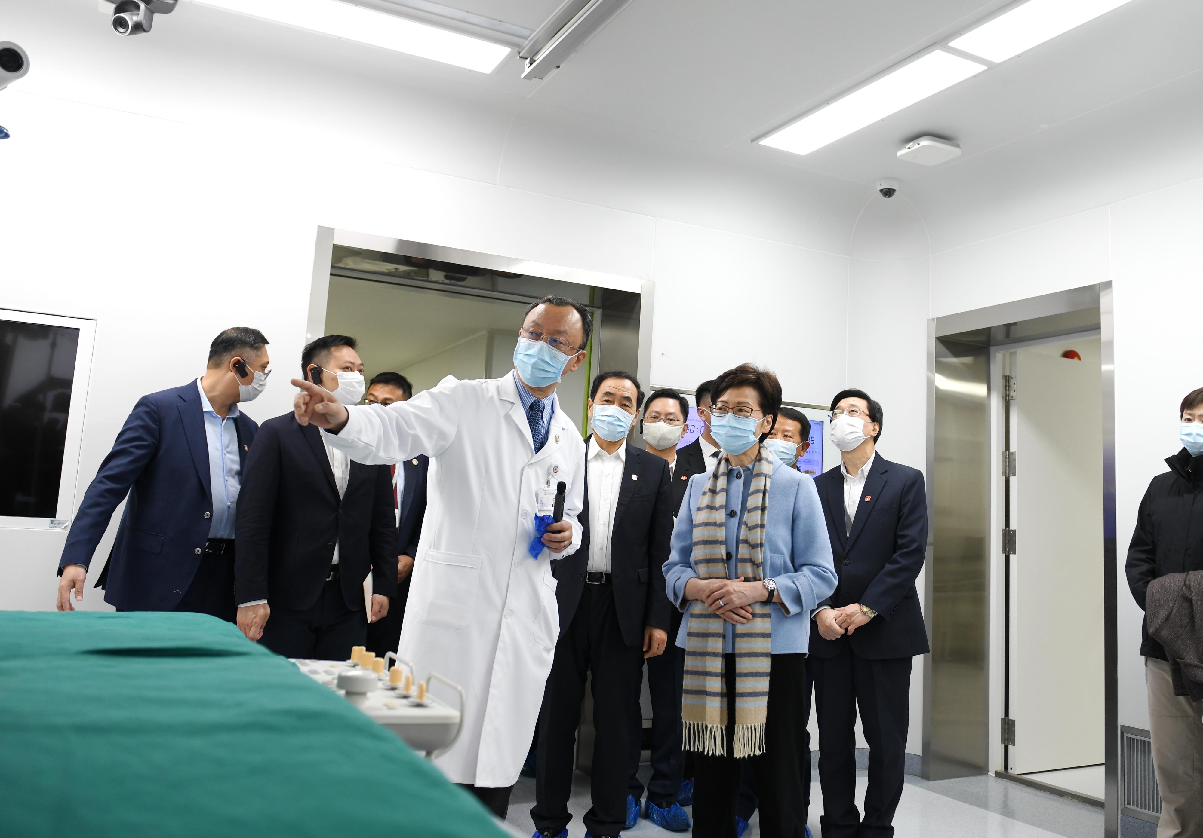 The Chief Executive, Mrs Carrie Lam, visited Wuhan Asia General Hospital, a Hong Kong enterprise, in Wuhan today (November 29). Photo shows Mrs Lam (front, right) touring an operating theatre of the hospital.