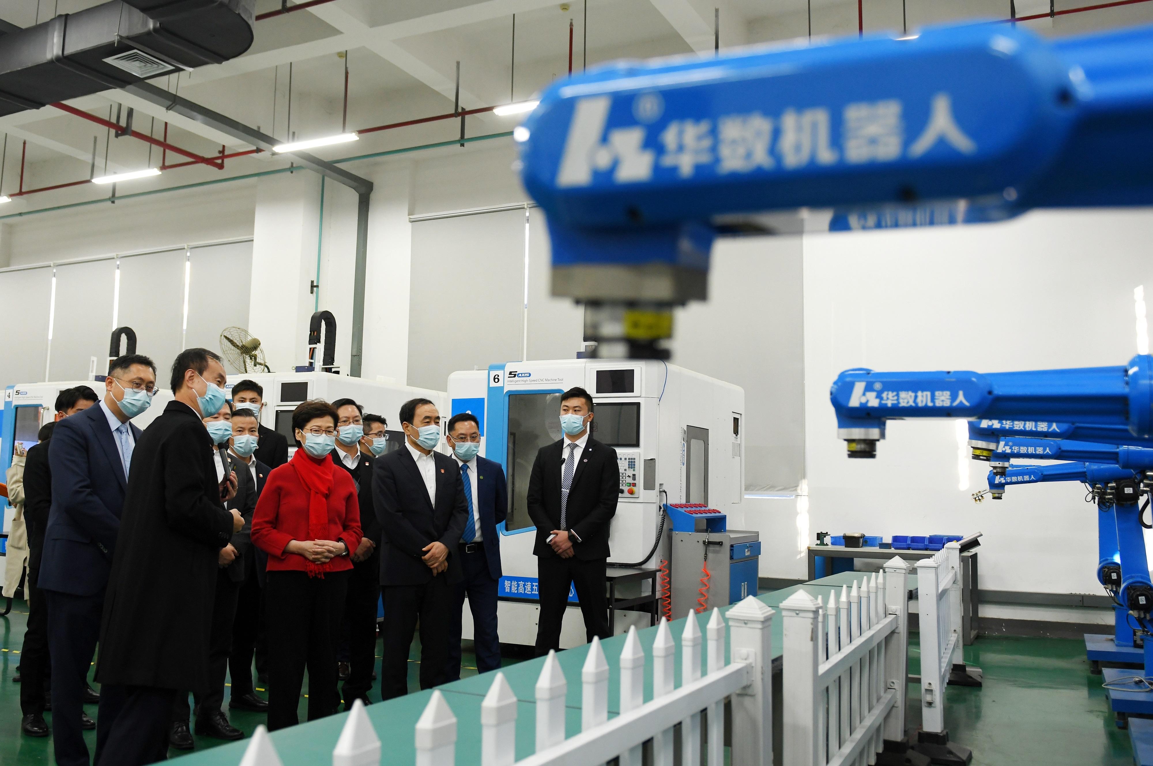 The Chief Executive, Mrs Carrie Lam, visited the Wuhan East Lake High-tech Development Zone in Wuhan today (November 30). Photo shows Mrs Lam (sixth right), accompanied by the Vice Governor of Hubei Province, Mr Zhao Haishan (third right), visiting a major technology firm in the zone. 