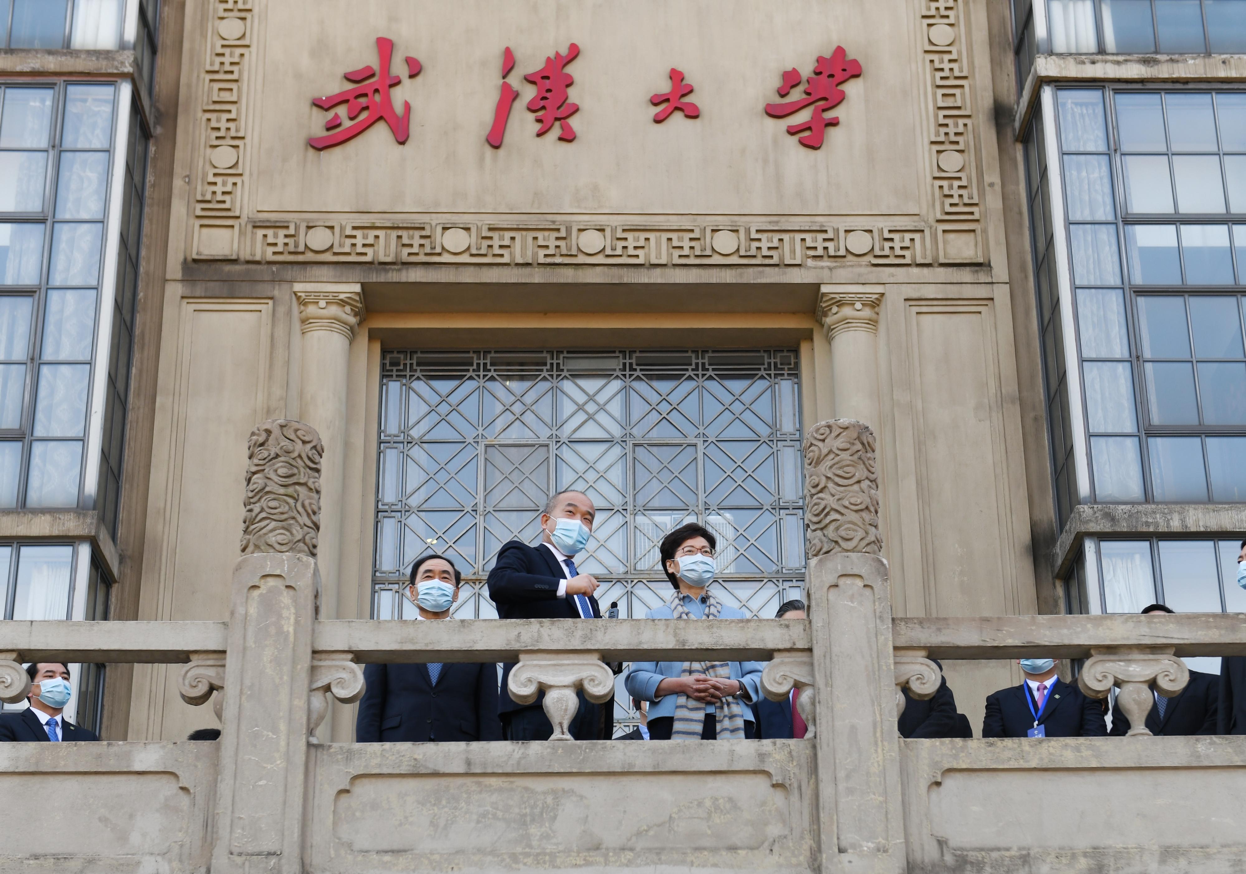 The Chief Executive, Mrs Carrie Lam, visited Wuhan University in Wuhan today (December 1). Photo shows Mrs Lam (right), accompanied by Vice Governor of Hubei Province Mr Zhao Haishan (left) and the President of Wuhan University, Professor Dou Xiankang (centre), touring the campus.
