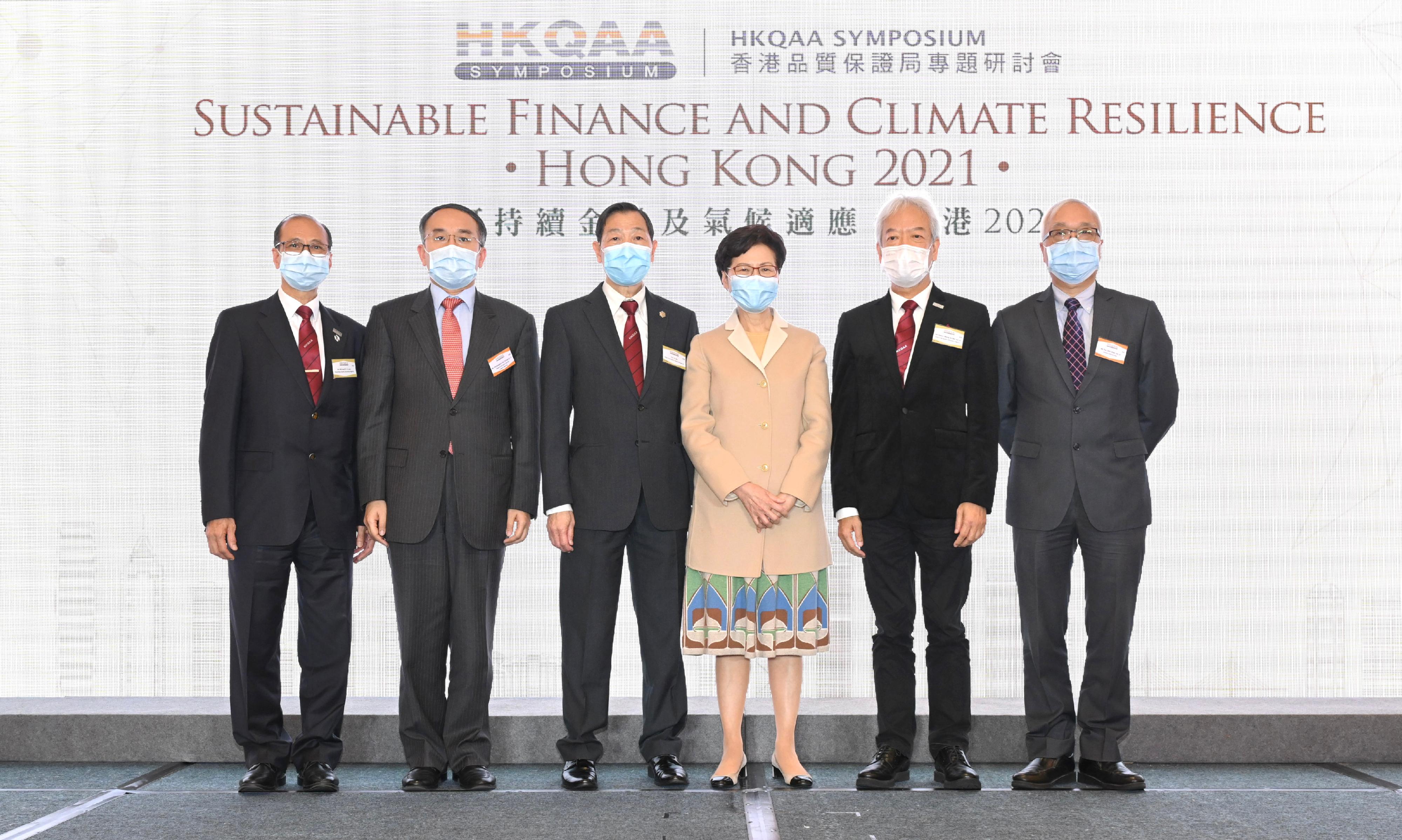 The Chief Executive, Mrs Carrie Lam, attended the HKQAA Symposium - Sustainable Finance and Climate Resilience • Hong Kong 2021 today (December 3). Photo shows (from left) the Chief Executive Officer of the Hong Kong Quality Assurance Agency (HKQAA), Dr Michael Lam; the Secretary for Financial Services and the Treasury, Mr Christopher Hui; the Chairman of the HKQAA, Mr Ho Chi-shing; Mrs Lam; the Deputy Chairman of the HKQAA, Mr Simon Wong; and the Under Secretary for the Environment, Mr Tse Chin-wan.