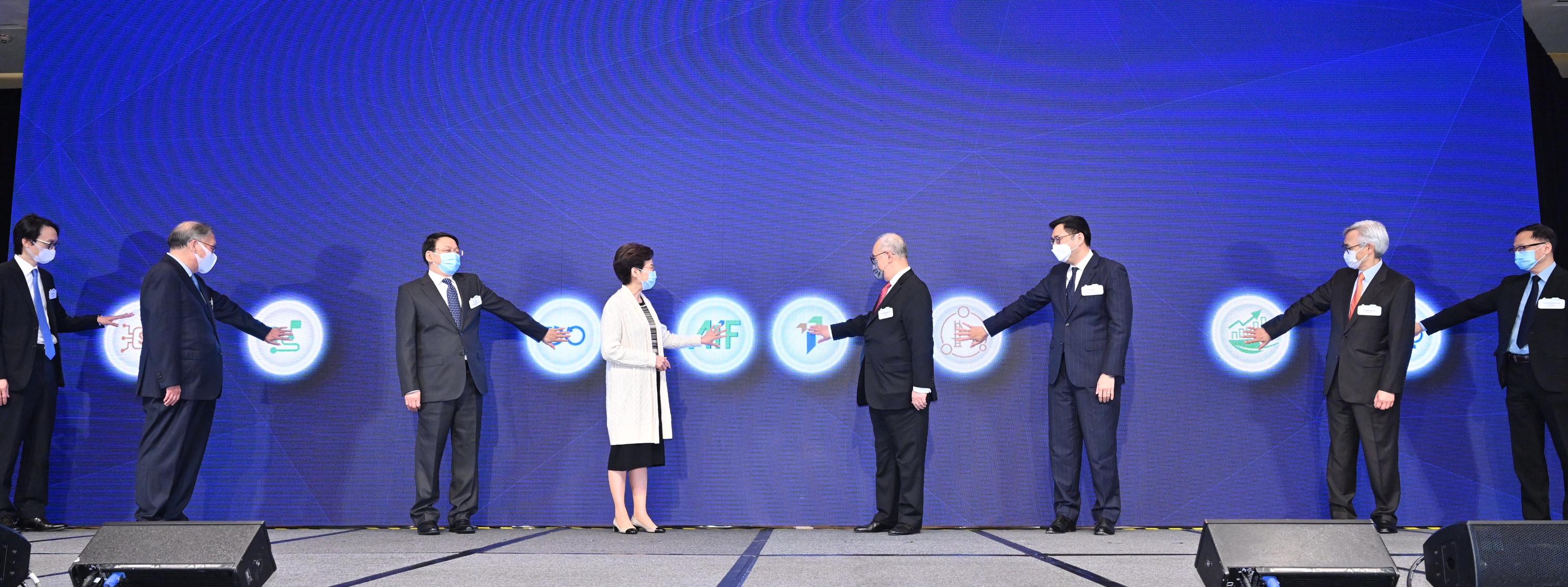 The Chief Executive, Mrs Carrie Lam, attended the Asian Insurance Forum 2021 Opening Ceremony this morning (December 7). Photo shows (from third left) Deputy Director of the Liaison Office of the Central People's Government in the Hong Kong Special Administrative Region Mr Yin Zonghua; Mrs Lam; the Chairman of the Insurance Authority, Dr Moses Cheng; the Chairman of the Financial Services Development Council, Mr Laurence Li, SC; Non-Executive Director of the Insurance Authority Mr Stephen Yiu; the Chief Executive Officer of the Insurance Authority, Mr Clement Cheung; and other guests officiating at the Opening Ceremony.