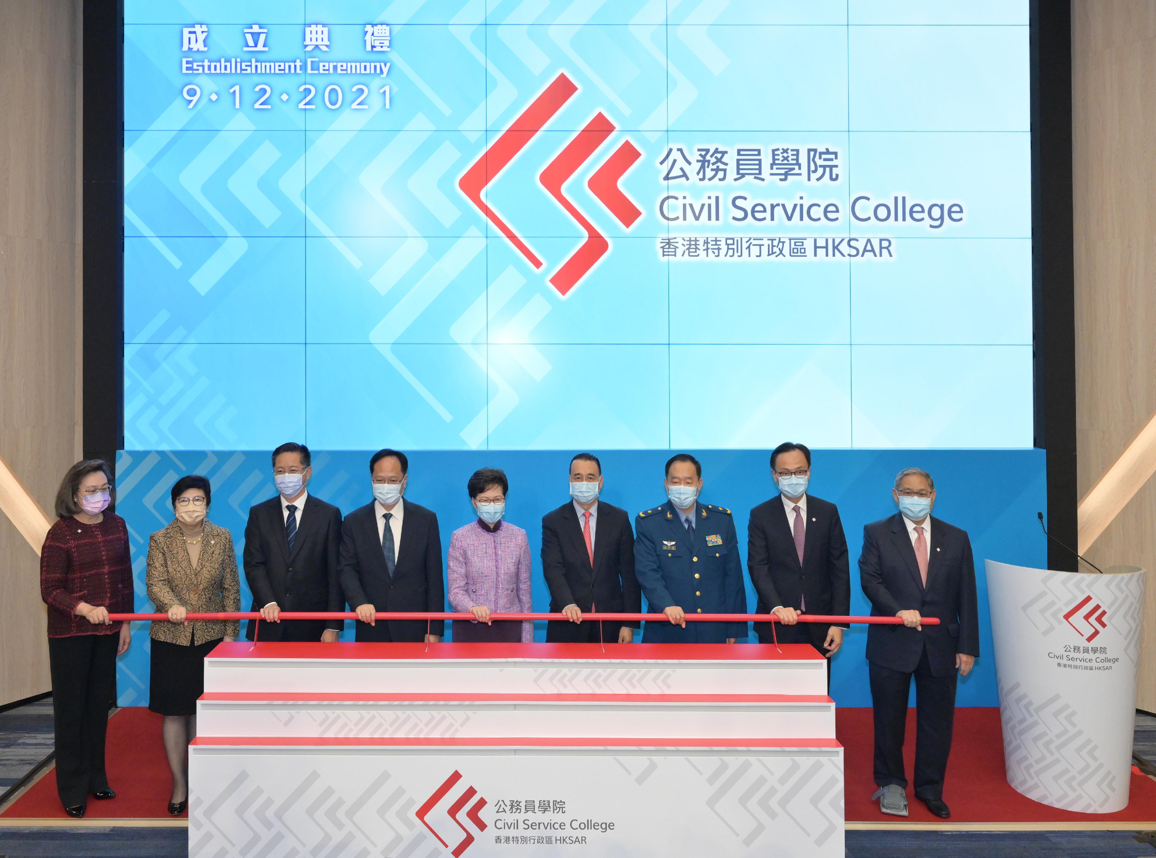 The Chief Executive, Mrs Carrie Lam, attended the Establishment Ceremony of the Civil Service College of the Hong Kong Special Administrative Region (HKSAR) today (December 9). Photo shows (from left) the Permanent Secretary for the Civil Service, Mrs Ingrid Yeung; the Chairman of the Public Service Commission, Mrs Rita Lau; Deputy Head of the Office for Safeguarding National Security of the Central People's Government in the HKSAR Mr Li Jiangzhou; Deputy Director of the Liaison Office of the Central People's Government in the HKSAR Mr Chen Dong; Mrs Lam;  the Commissioner of the Ministry of Foreign Affairs of the People's Republic of China in the HKSAR, Mr Liu Guangyuan; the Director of the Political Department of the Chinese People's Liberation Army Hong Kong Garrison, Major General Sun Jushun; the Secretary for the Civil Service, Mr Patrick Nip; and the Chairman of the Civil Service Training Advisory Board, Dr Victor Fung, officiating at the ceremony. 

