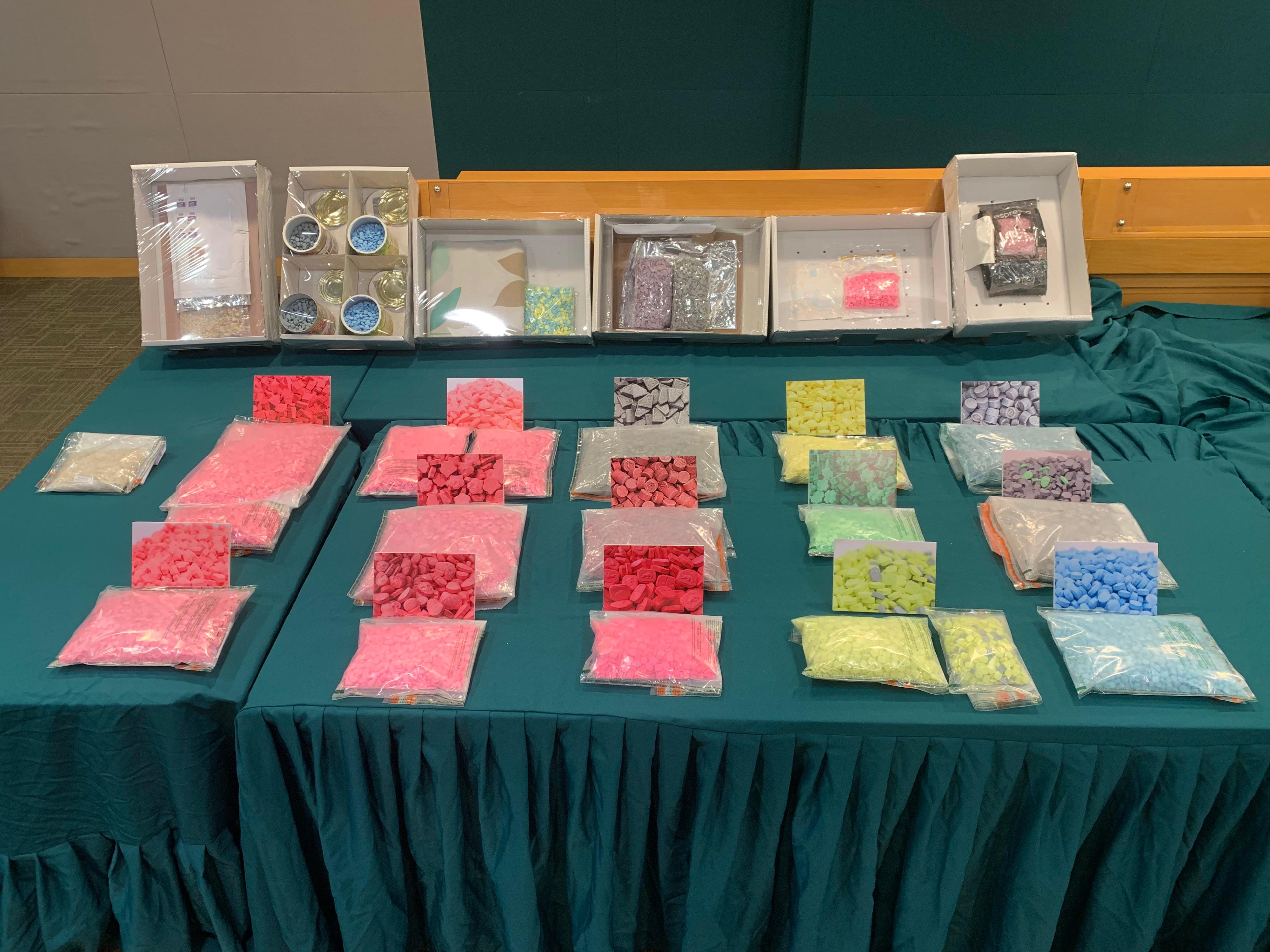 In the light of local demand for drugs during the long holidays, Hong Kong Customs mounted a special operation from November 1 to today (December 10) to combat party drug trafficking activities. Different kinds of party drugs with a total estimated value about $36 million were seized, including about 52 000 tablets of suspected ecstasy and about 153 kilograms of suspected cannabis buds. Photo shows some of the suspected ecstasy seized and the concealment methods.