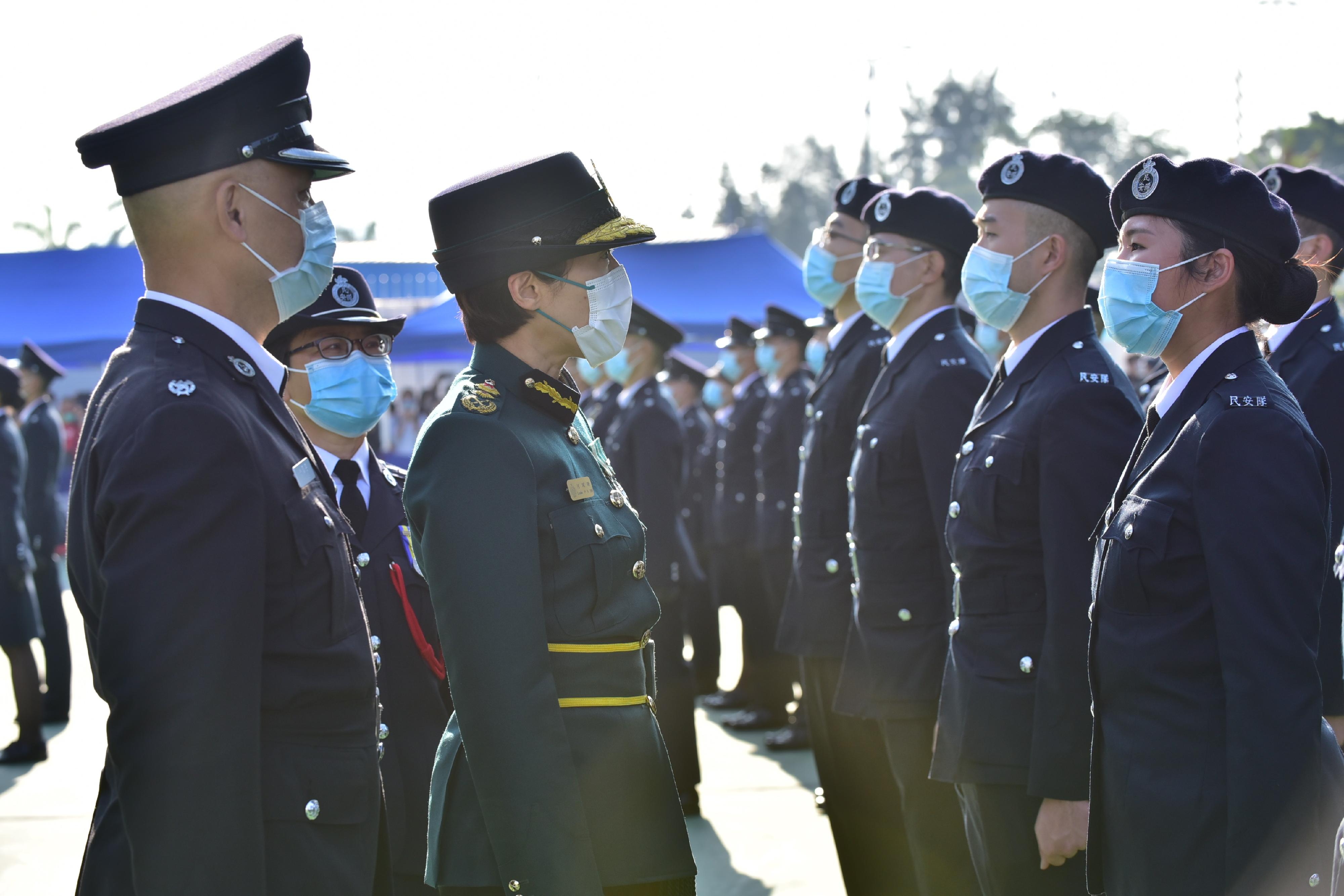 The Civil Aid Service held the 83rd Recruits Passing-out Parade at its headquarters today (December 12). Photo shows the Commissioner of Customs and Excise, Ms Louise Ho (third left), inspecting the parade.