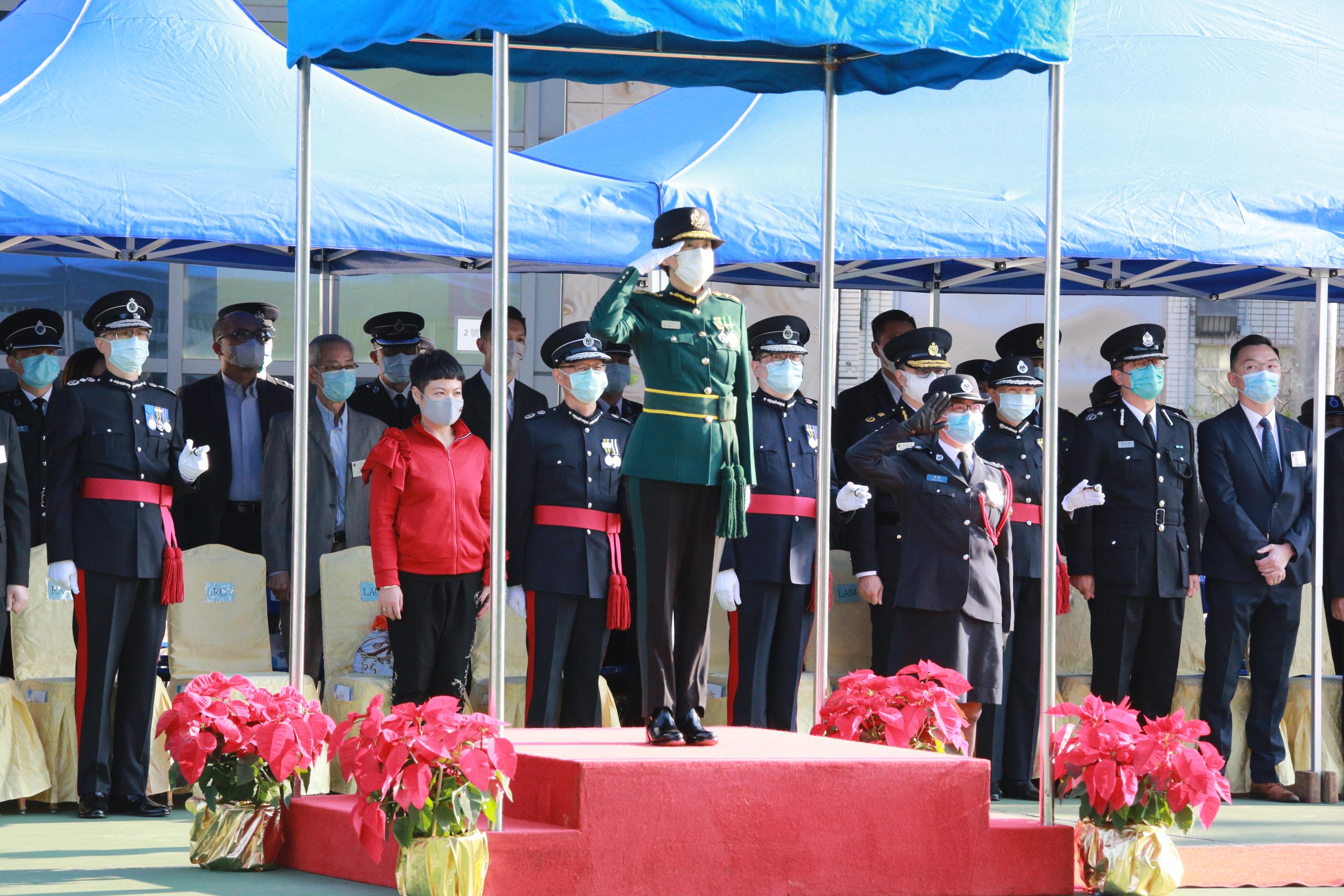 The Civil Aid Service held the 83rd Recruits Passing-out Parade at its headquarters today (December 12). Photo shows the Commissioner of Customs and Excise, Ms Louise Ho, taking the salute from the parade.