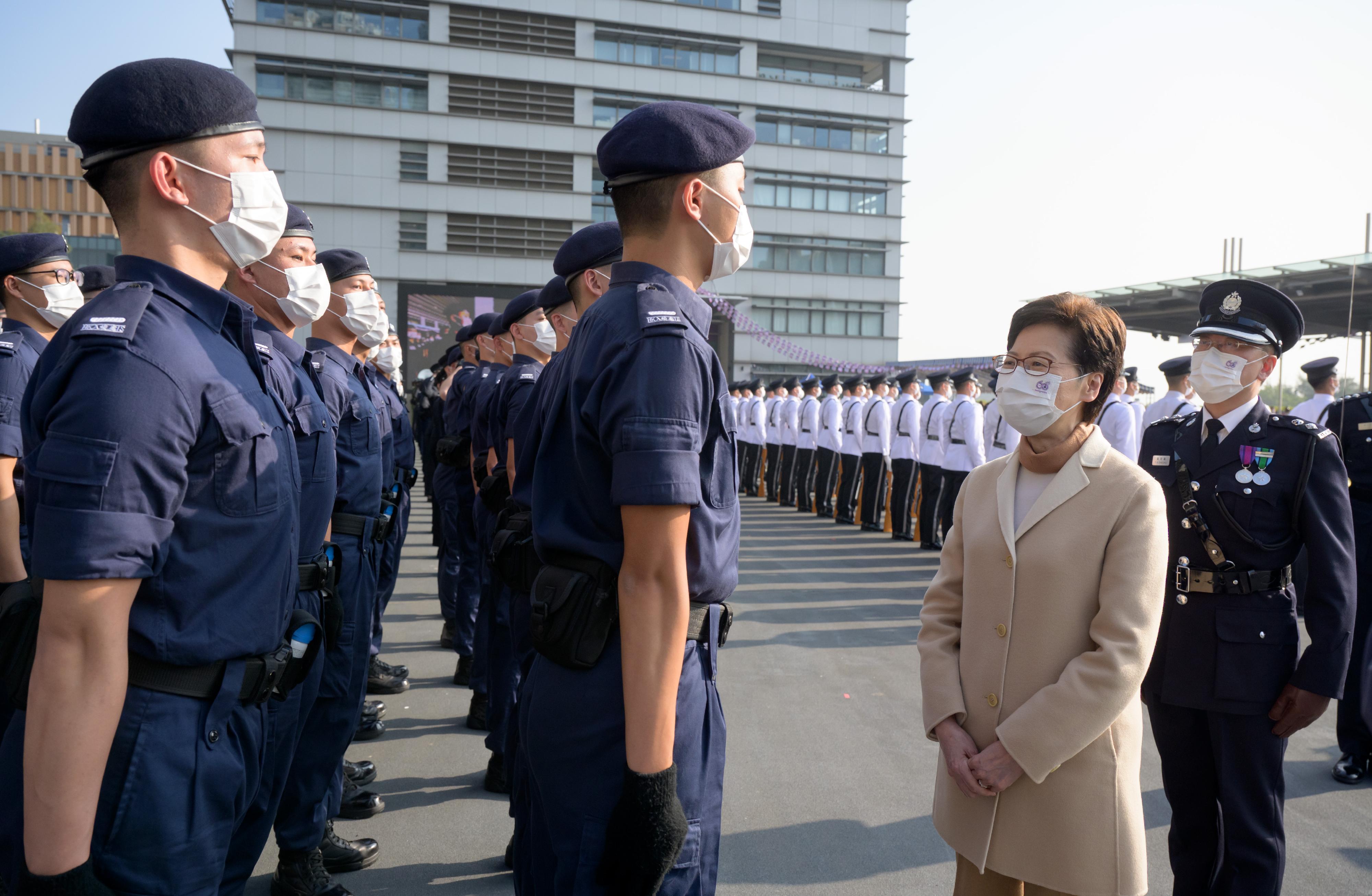 The Chief Executive, Mrs Carrie Lam (second right), inspects a contingent of graduates at the Immigration Department Passing-out Parade cum 60th Anniversary Grand Parade today (December 30).