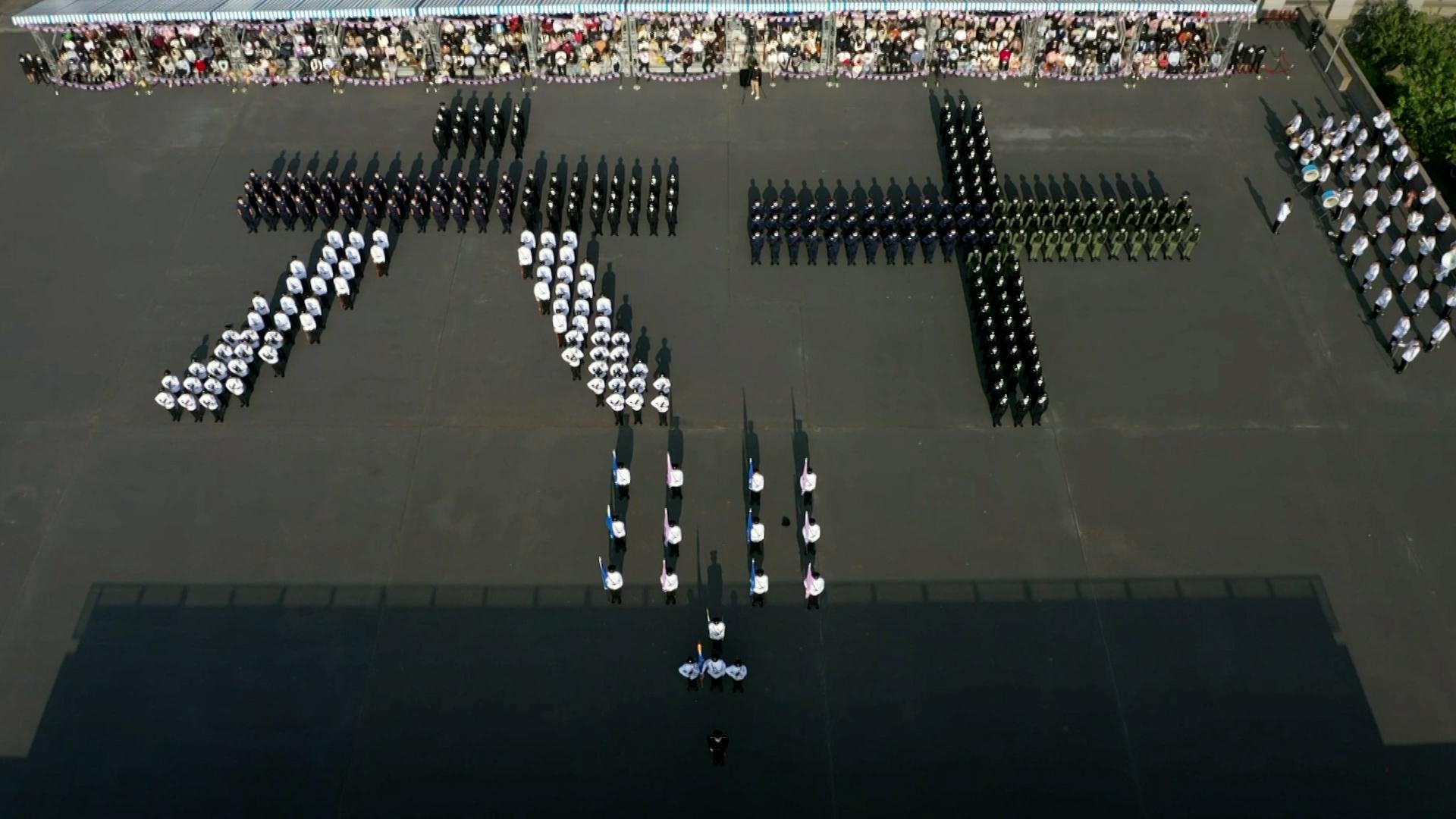 The Immigration Department Passing-out Parade cum 60th Anniversary Grand Parade was held today (December 30). Photo shows the parade lining up to form the Chinese numerals for "60" in the Chinese-style foot drill performance to symbolise the 60th anniversary of the Immigration Department.