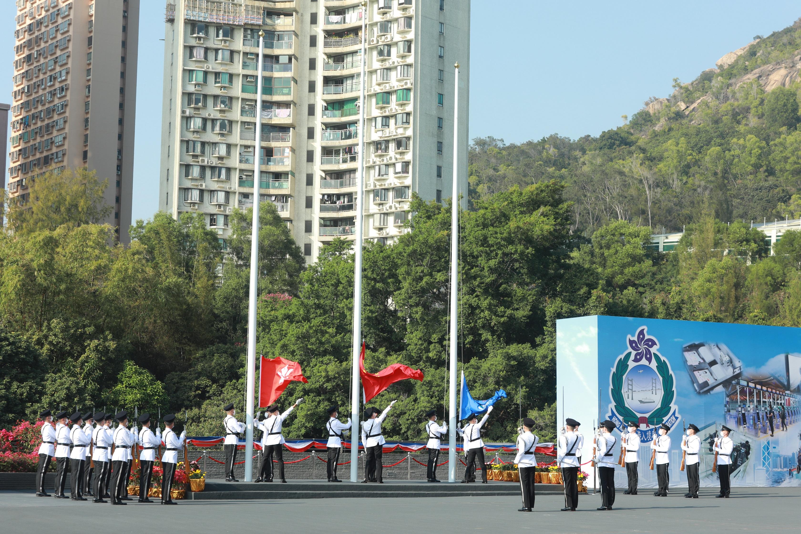 The Flag Party performs a Chinese-style flag-raising ceremony at the Immigration Department Passing-out Parade cum 60th Anniversary Grand Parade today (December 30).