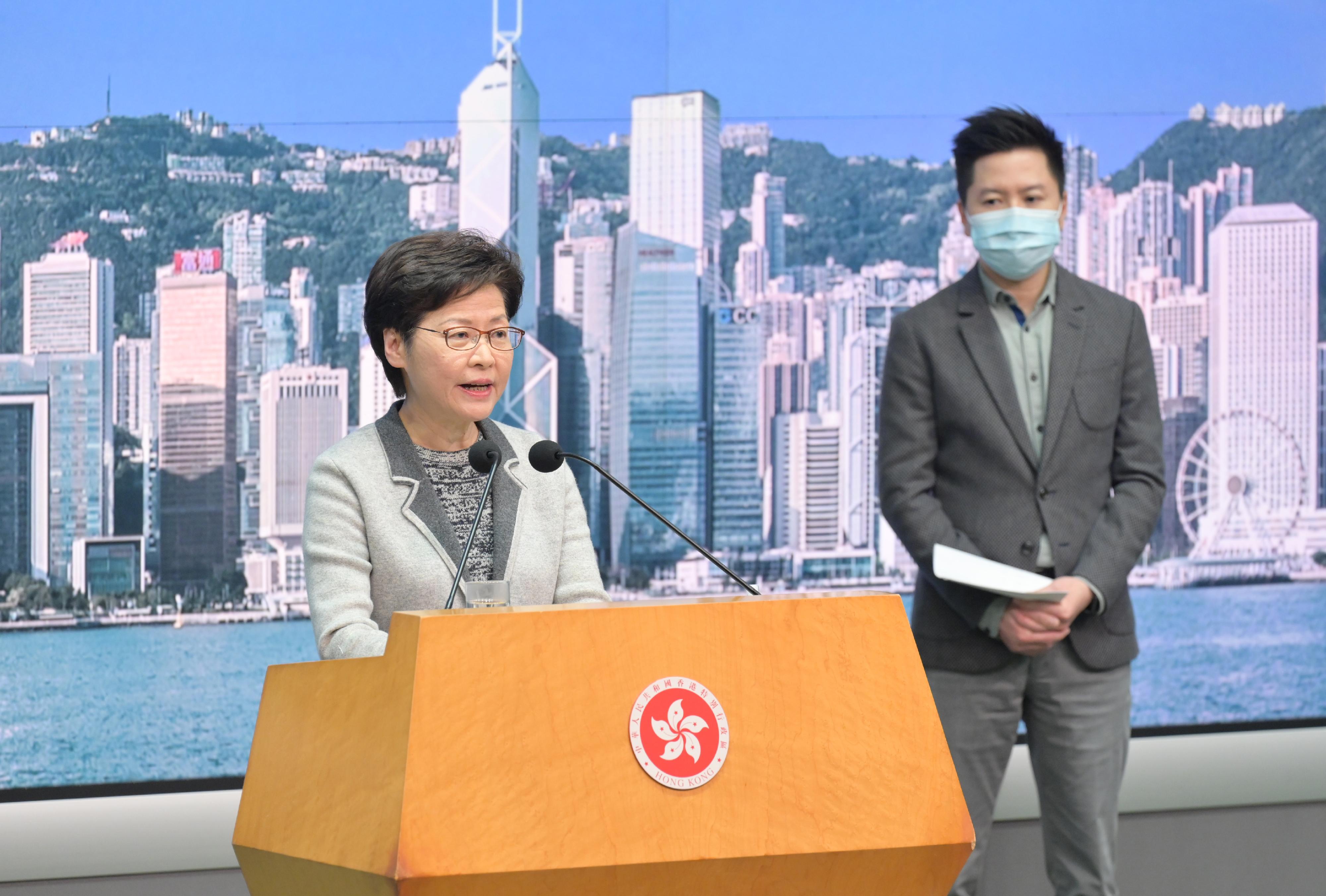 The Chief Executive, Mrs Carrie Lam (left), meets the media at the Central Government Offices, Tamar, today (January 6). Looking on is the Controller of the Centre for Health Protection of the Department of Health, Dr Edwin Tsui.