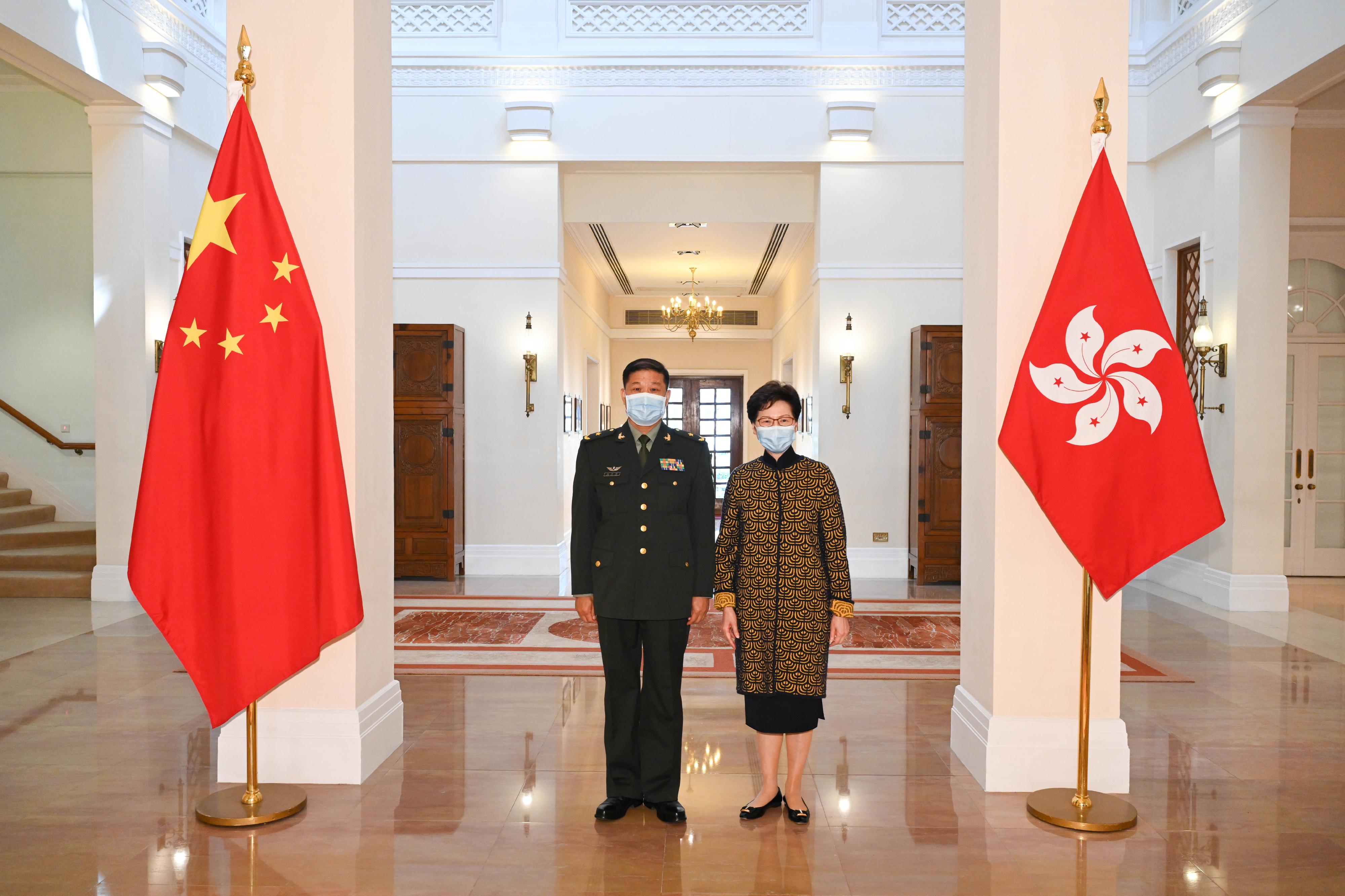 The Chief Executive, Mrs Carrie Lam (right), meets the Commander-in-chief of the Chinese People's Liberation Army Hong Kong Garrison, Major General Peng Jingtang (left), at Government House this morning (January 10).