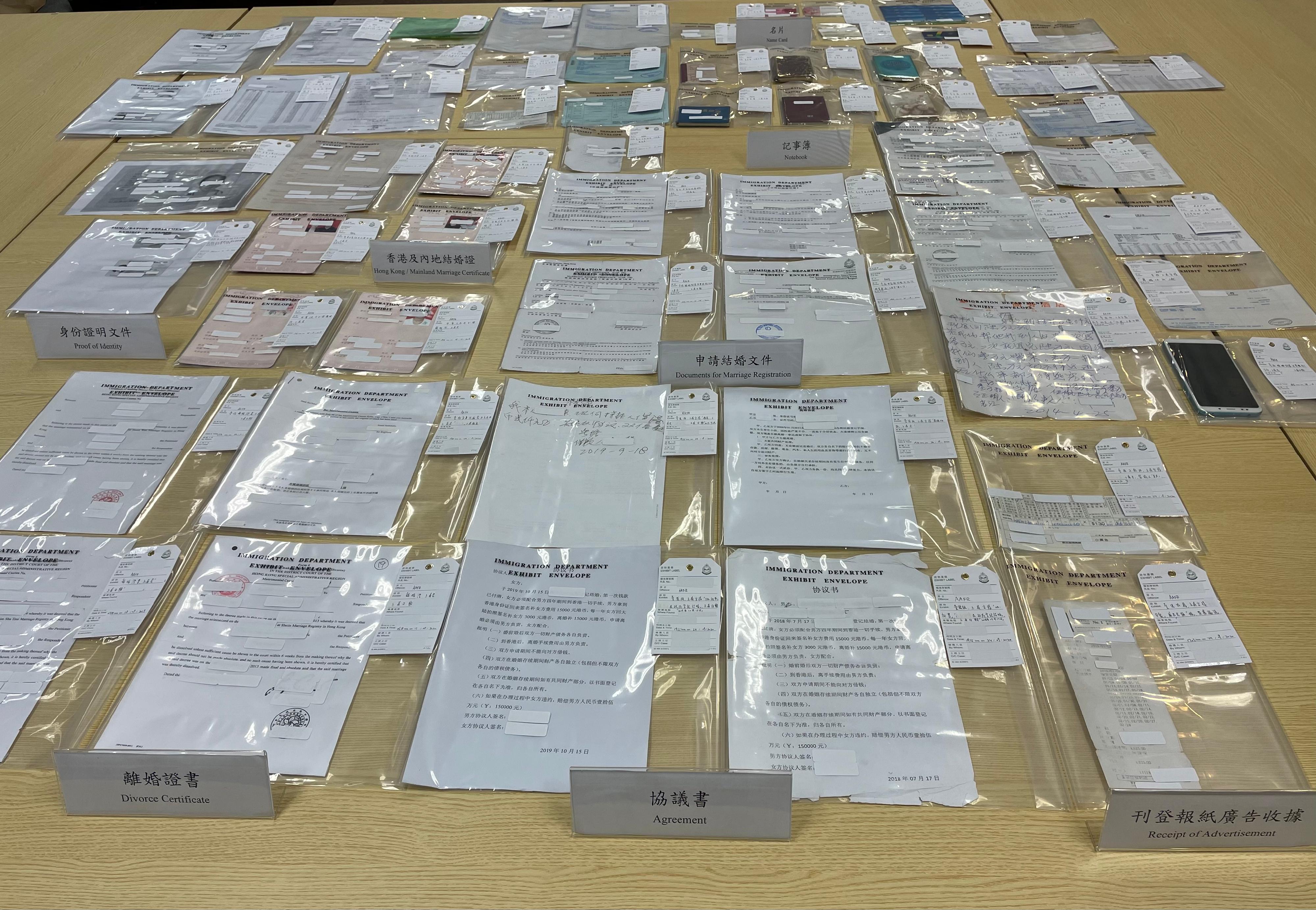 The Special Investigation Section of the Immigration Department launched an operation codenamed "Flashspear 2020" combatting bogus marriage activities. Photo shows exhibits seized during the operation.