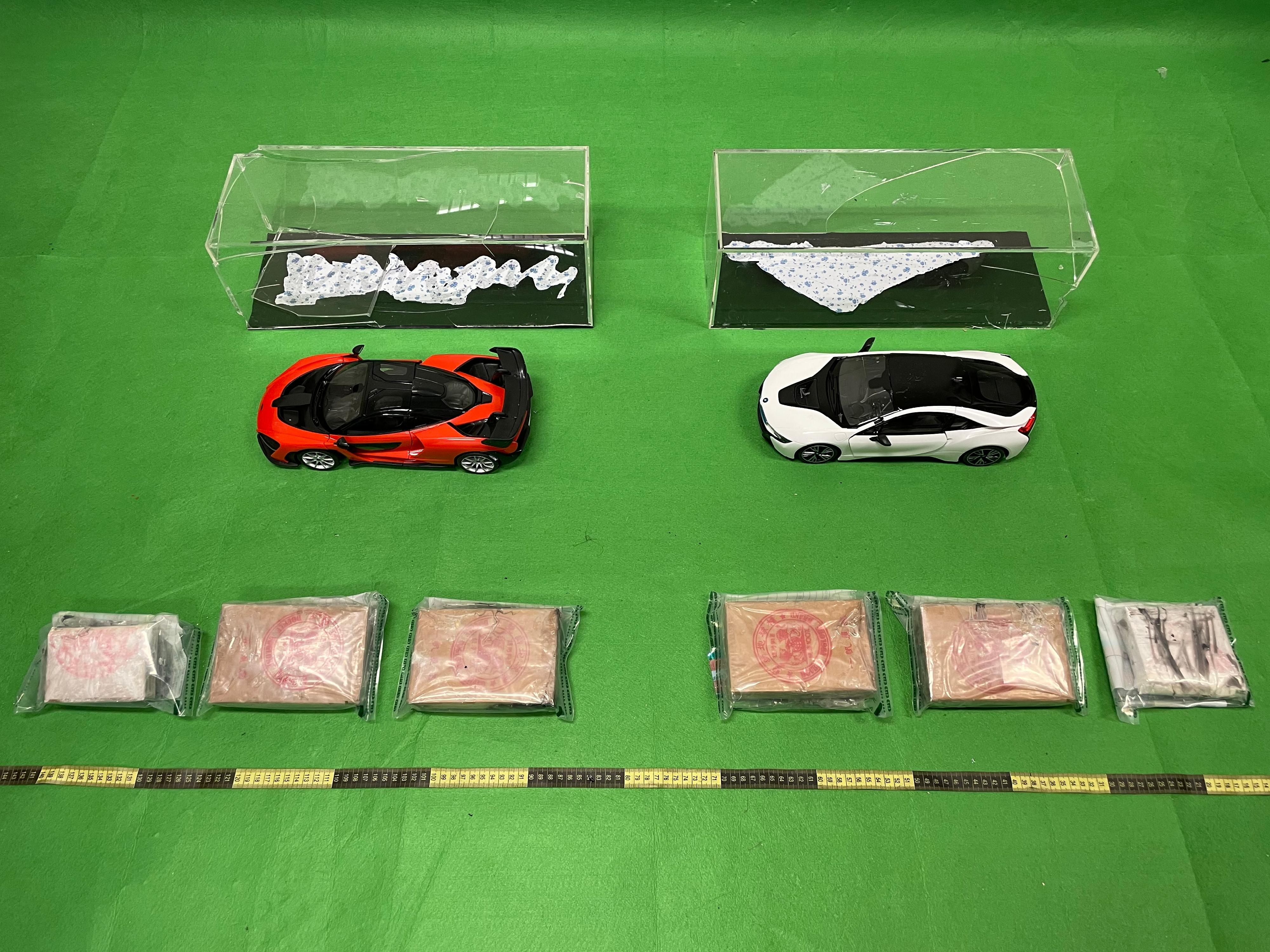 Hong Kong Customs seized about 3.5 kilograms of suspected heroin with an estimated market value of about $4.6 million at Hong Kong International Airport on January 12 and 13. Photo shows the suspected heroin seized by Customs officers in one of the cases and the model car display racks used to conceal the drugs.