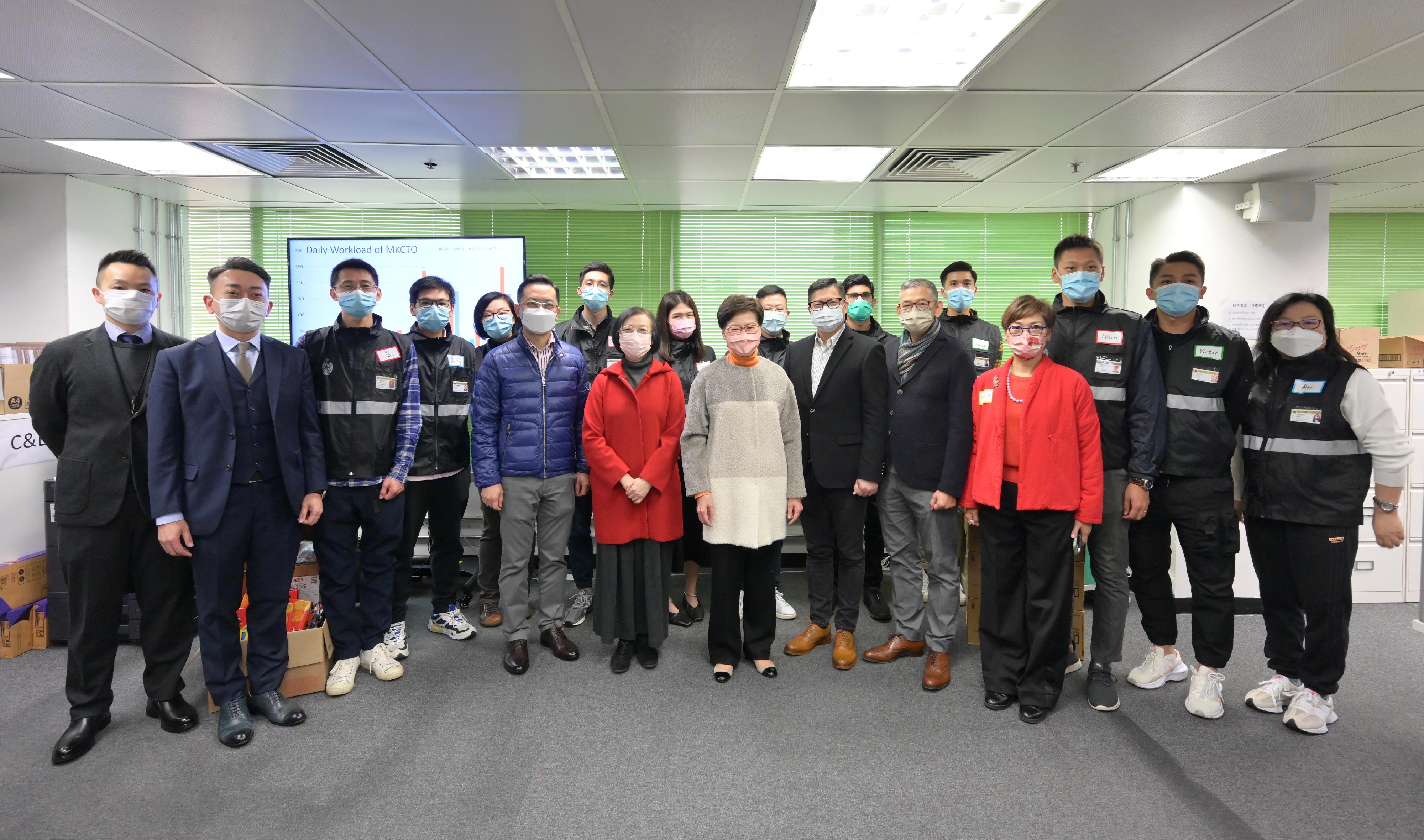 The Chief Executive, Mrs Carrie Lam, visited the Contact Tracing Offices in Kai Tak and Mong Kok today (February 1). Photo shows (front row, from left) the Director of Health, Dr Ronald Lam; the Secretary for Food and Health, Professor Sophia Chan; Mrs Lam; the Secretary for Security, Mr Tang Ping-keung; the Commissioner of Correctional Services, Mr Woo Ying-ming; and officers of the Correctional Services Department at the Contact Tracing Office in Mong Kok.