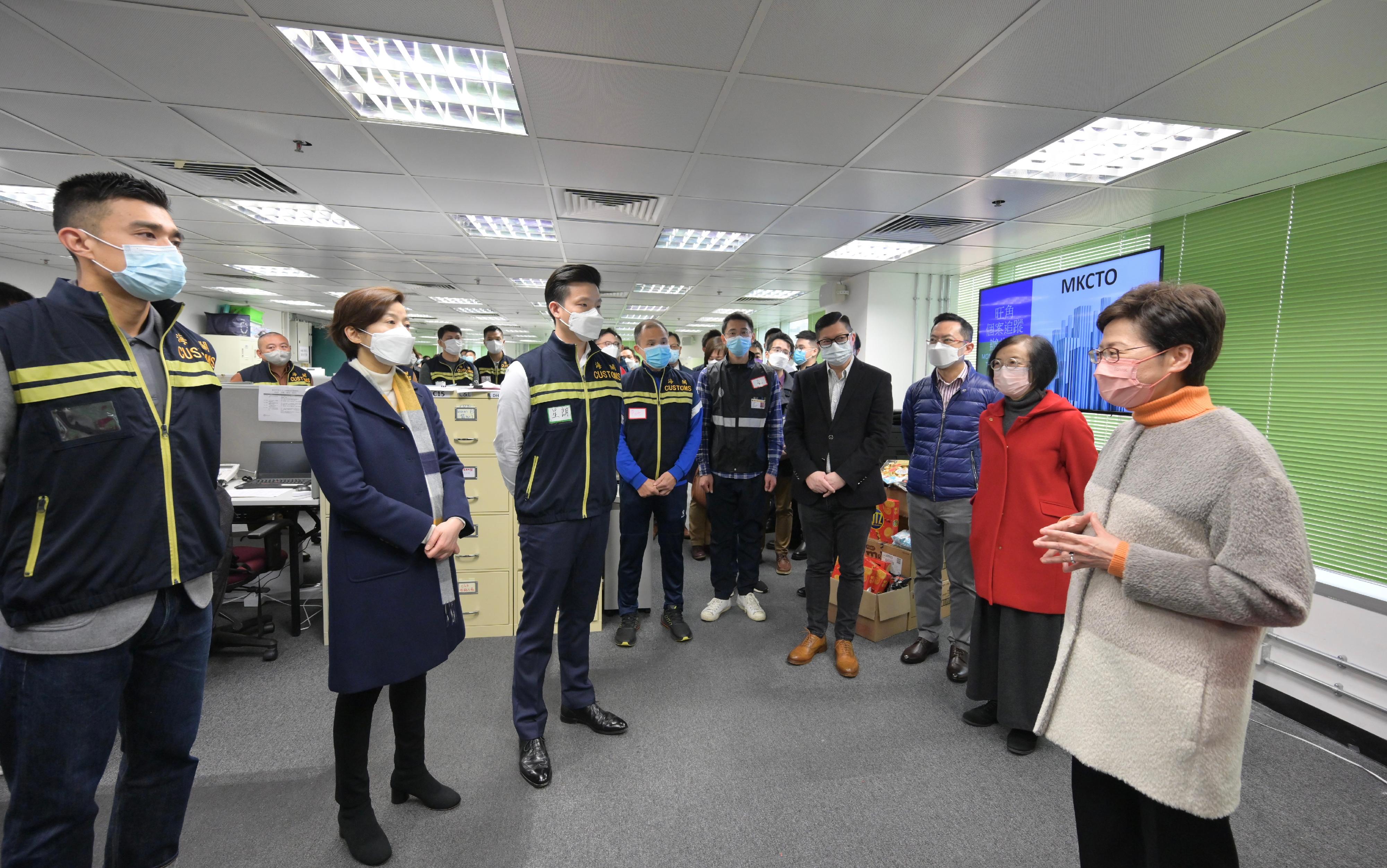 The Chief Executive, Mrs Carrie Lam, visited the Contact Tracing Offices in Kai Tak and Mong Kok today (February 1). Photo shows Mrs Lam (first right) chatting with the Commissioner of Customs and Excise, Ms Louise Ho (second left), and customs officers at the Contact Tracing Office in Mong Kok. Looking on are the Secretary for Food and Health, Professor Sophia Chan (second right); the Secretary for Security, Mr Tang Ping-keung (fourth right); and the Director of Health, Dr Ronald Lam (third right).