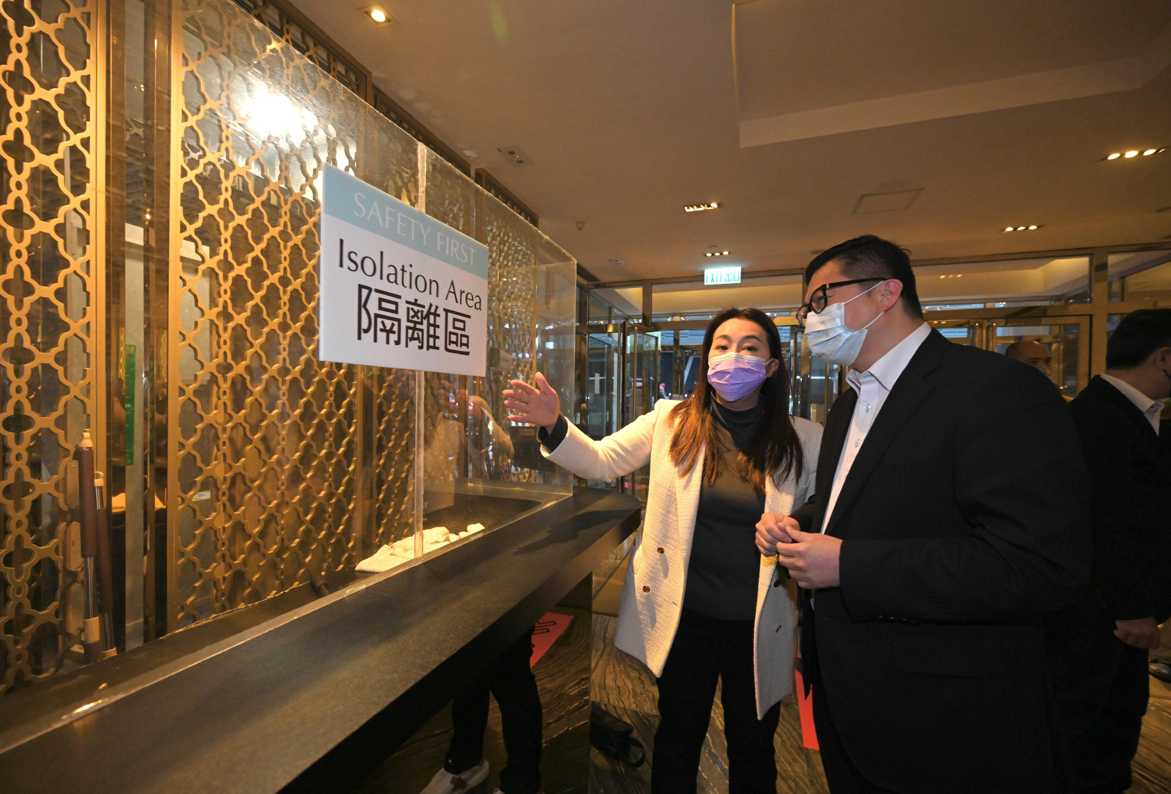 The Secretary for Security, Mr Tang Ping-keung, inspected the Dorsett Tsuen Wan, Hong Kong this afternoon (February 17), ensuring the first hotel turned into a community isolation facility is ready. Photo shows Mr Tang (right) learning from the President and Executive Director, Dorsett Hospitality International, Ms Winnie Chiu (left), about the preparatory work for turning the hotel into the community isolation facility.