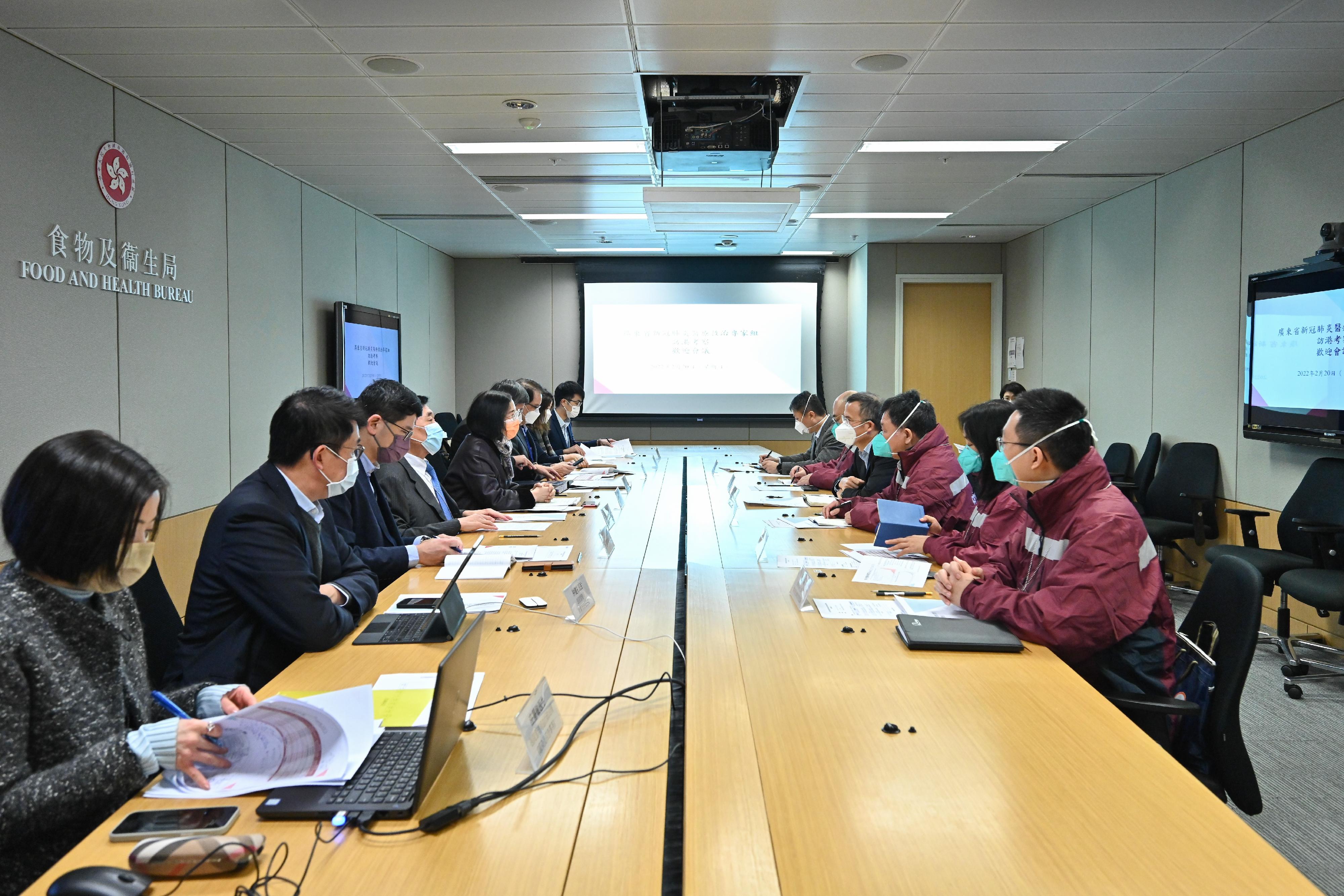 The Food and Health Bureau (FHB) and the Hospital Authority (HA) held a meeting with the Guangdong COVID-19 medical expert delegation (expert delegation) at the Central Government Offices this morning (February 20). Photo shows the Secretary for Food and Health, Professor Sophia Chan (fifth left); the Permanent Secretary for Food and Health (Health), Mr Thomas Chan (sixth left); the Project Director of the Chinese Medicine Hospital Project Office, Dr Cheung Wai-lun (seventh left); the Chairman of the HA, Mr Henry Fan (fourth left); the Chief Executive of the HA, Dr Tony Ko (third left); the HA Director (Quality and Safety), Dr Chung Kin-lai (second left), and other representatives of the FHB and the HA sharing experience in treating COVID-19 patients with the Deputy Director General of the Health Commission of Guangdong Province, Mr Zhang Yurun (fourth right); the second level consultant of the Health Commission of Guangdong Province, Mr Sun Baoshan (sixth right); the Leader of the expert delegation, Mr Qin Tiehe (third right); the Deputy Leader of the expert delegation, Mr Li Yimin (fifth right); members of the expert delegation, Ms Wang Shouhong (second right) and Mr Xu Yonghao (first right) in the meeting.