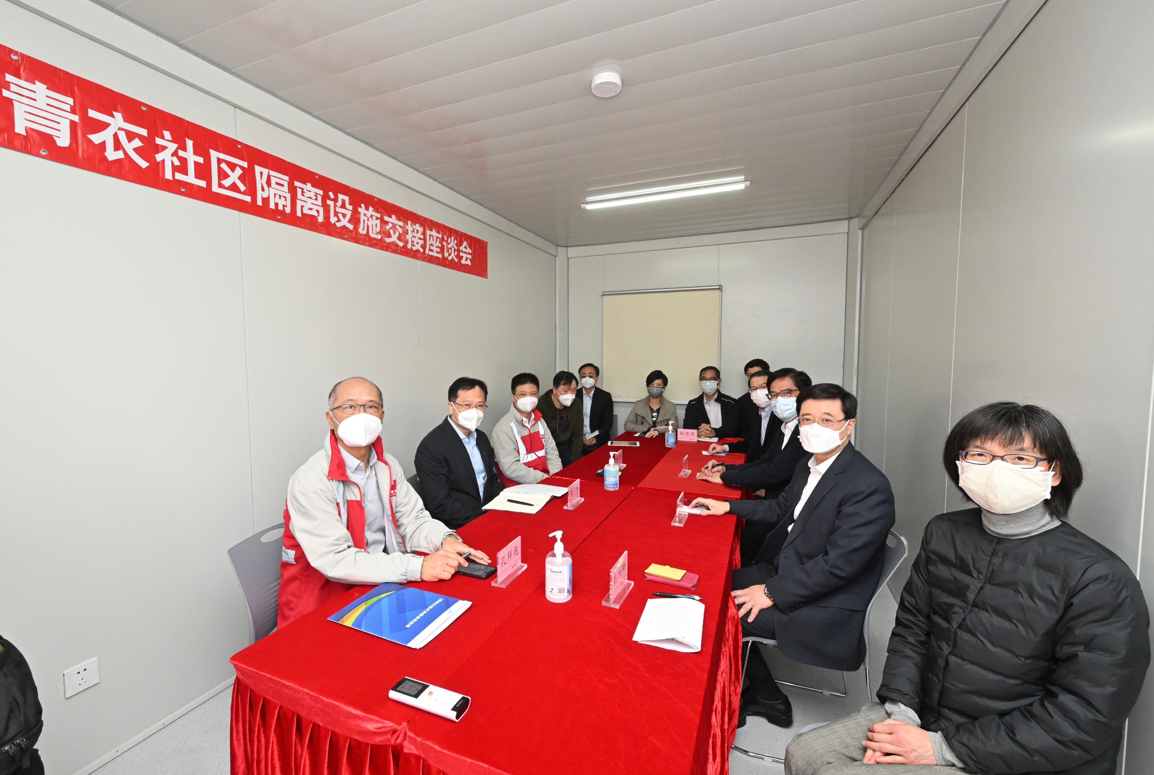 The Chief Secretary for Administration, Mr John Lee, today (March 1) visited the community isolation facilities constructed with the support of the Central Government in Tsing Yi. Photo Shows Mr Lee (second right); Deputy Director of the Liaison Office of the Central People's Government in the Hong Kong Special Administrative Region Mr Chen Dong (second left); and the Chairman and Non-executive Director of the China State Construction International Holdings Limited, Mr Yan Jianguo (third left), in a hand over meeting before visiting the facilities. Other attendees included the Secretary for Development, Mr Michael Wong (third right); the Permanent Secretary for Food and Health (Food), Miss Vivian Lau (first right); and the Under Secretary for Security, Mr Sonny Au (fourth right).