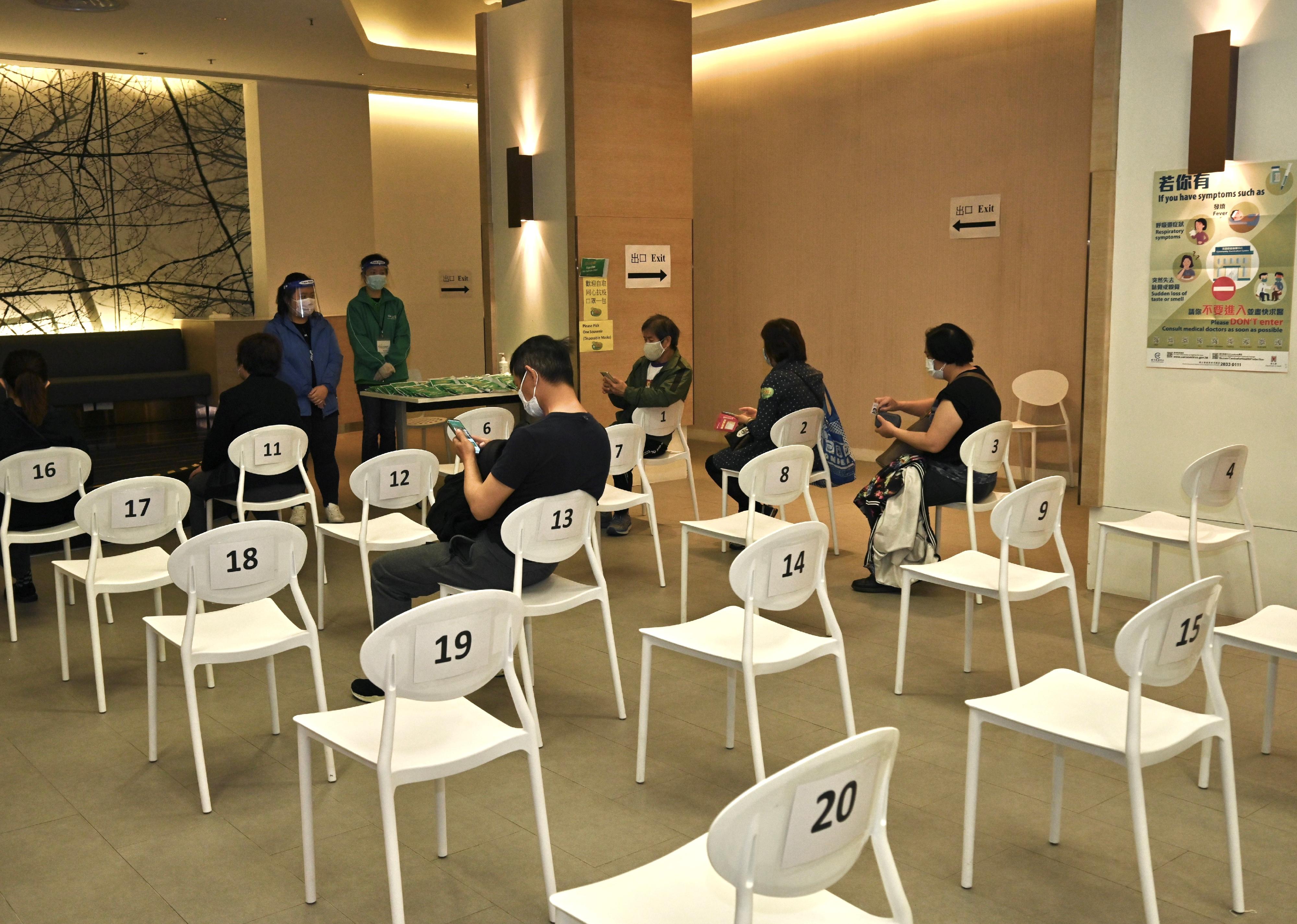 The Hong Kong Spinners Industrial Building Community Vaccination Centre is dedicated to providing the Sinovac vaccination service to children and teenagers aged 3 to 17 and persons aged 60 or above. Photo shows vaccinated people in the resting area.