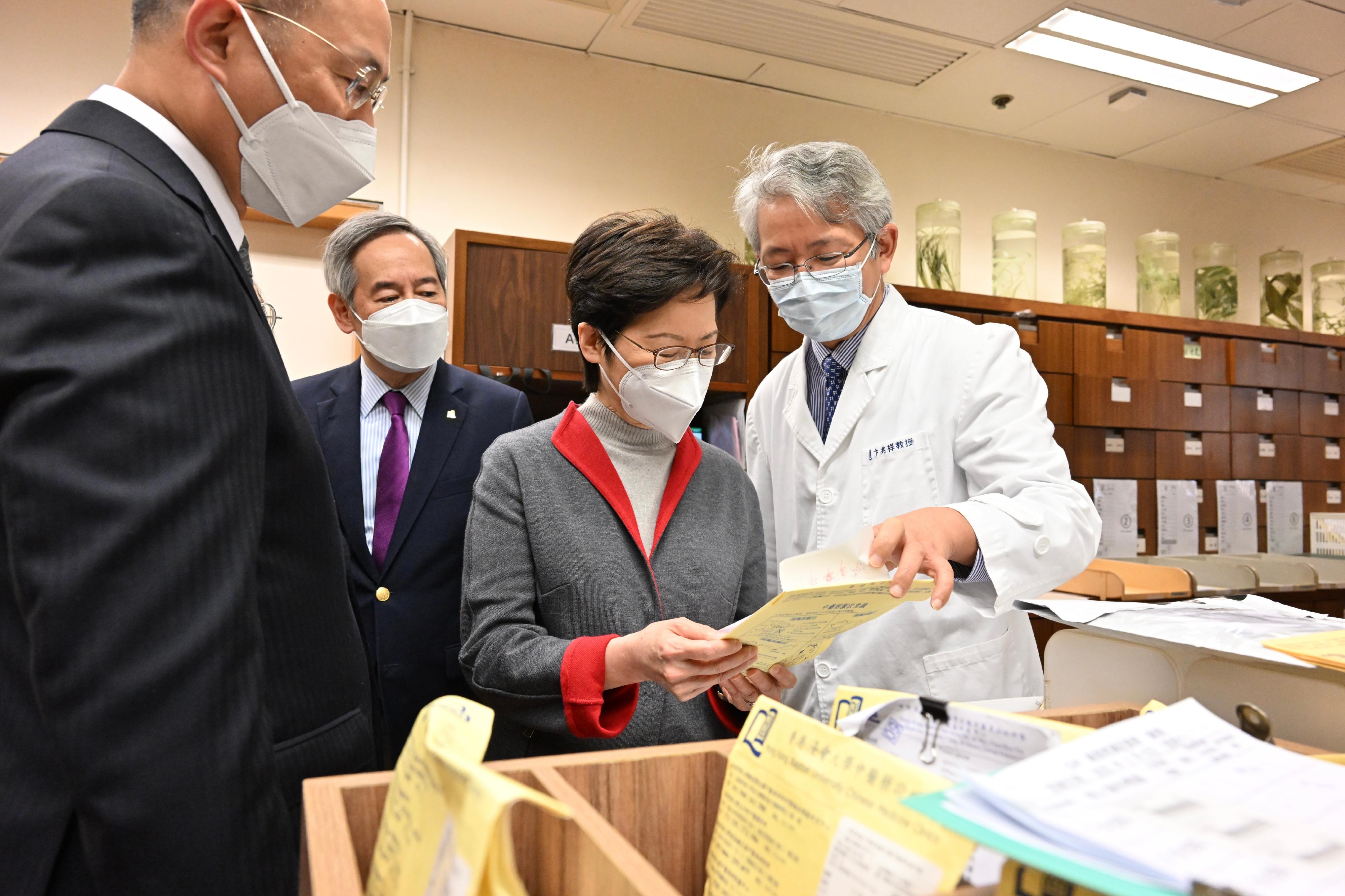 The Chief Executive, Mrs Carrie Lam, visited the Chinese Medicine Telemedicine Centre Against COVID-19 of the Hong Kong Baptist University (HKBU) today (March 12). Photo shows Mrs Lam (second right) inspecting the operation of the dispensary. Looking on are the Chairman of the Council of HKBU, Dr Clement Chen (second left); the President and Vice-Chancellor of HKBU, Professor Alexander Wai (first left); and the Associate Vice-President (Chinese Medicine Development) and Director of the Clinical Division of the School of Chinese Medicine of HKBU, Professor Bian Zhaoxiang (first right).
