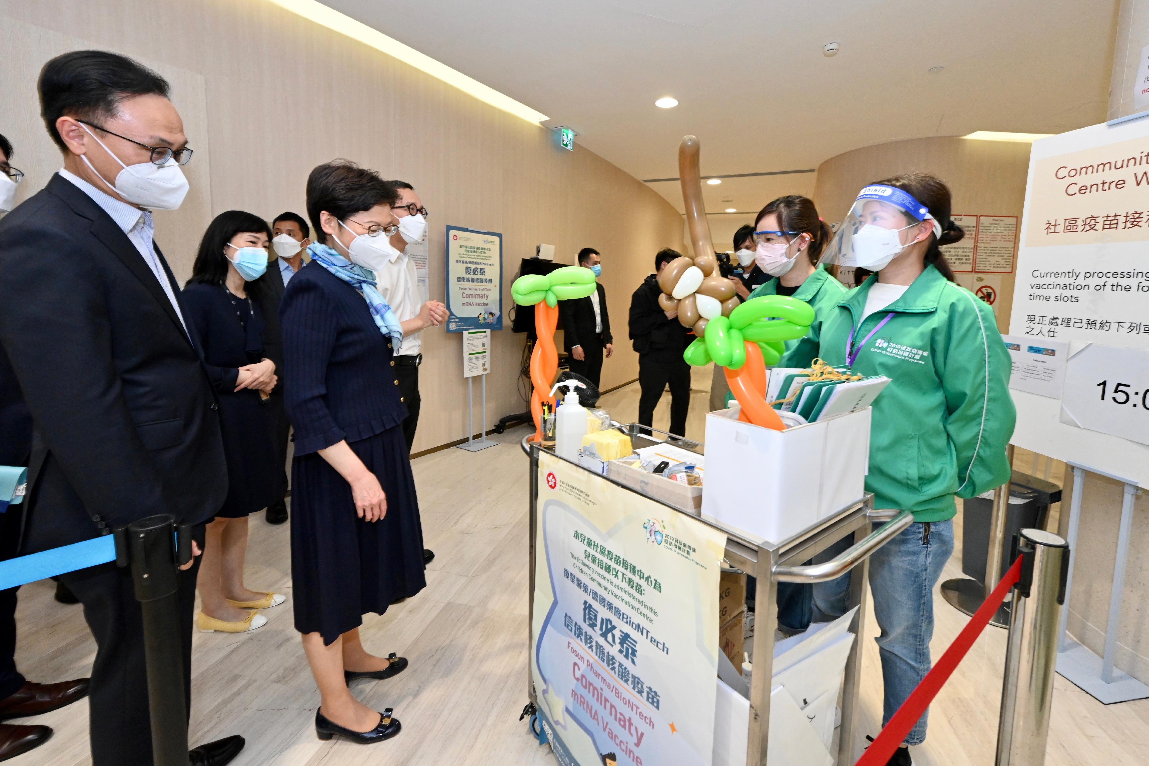 The Chief Executive, Mrs Carrie Lam (fourth left), visits the HKU Children Community Vaccination Centre at Gleneagles Hospital Hong Kong today (March 18). Looking on is the Secretary for the Civil Service, Mr Patrick Nip (first left).